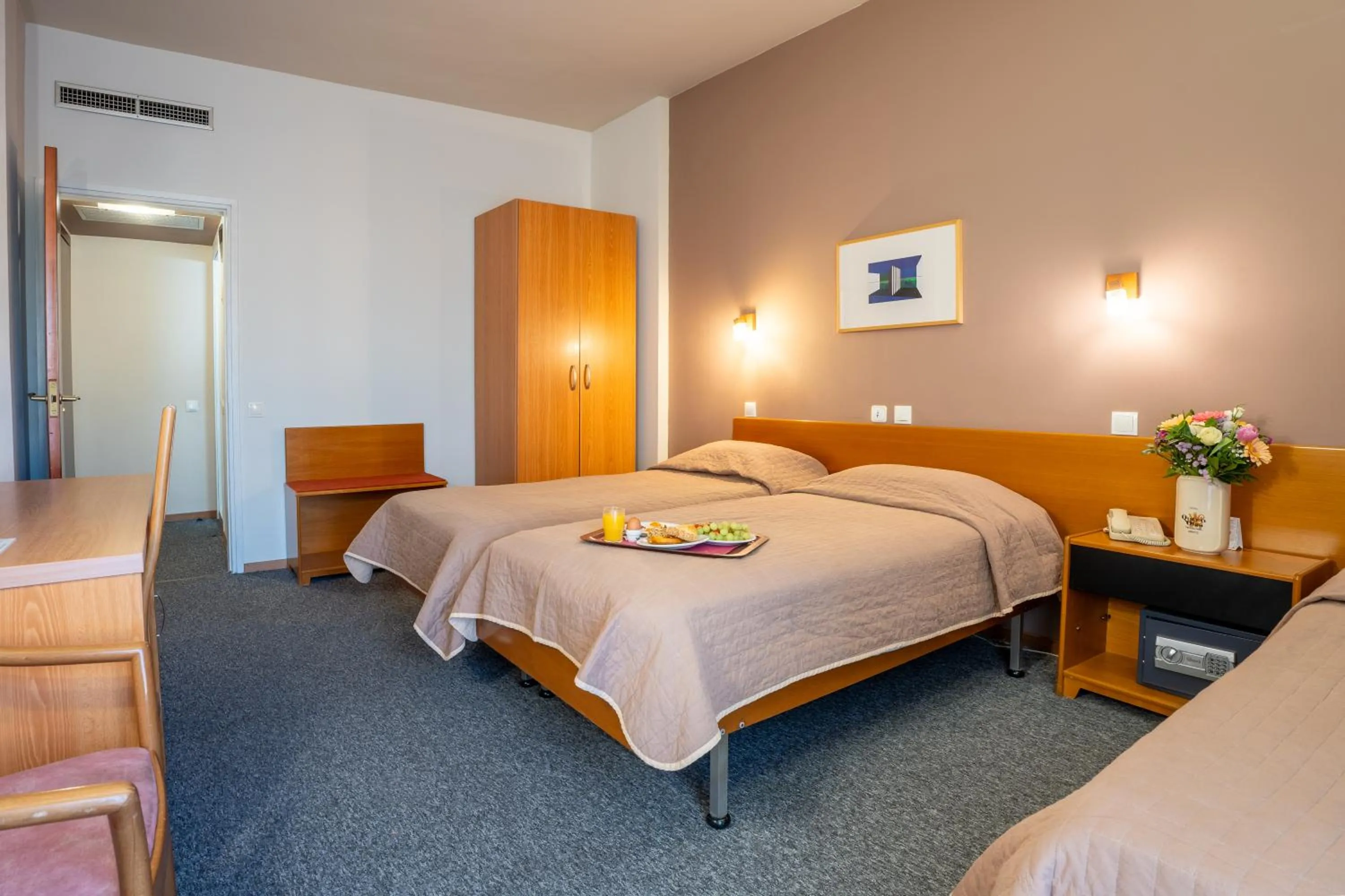 Bed in Queen Olga Hotel