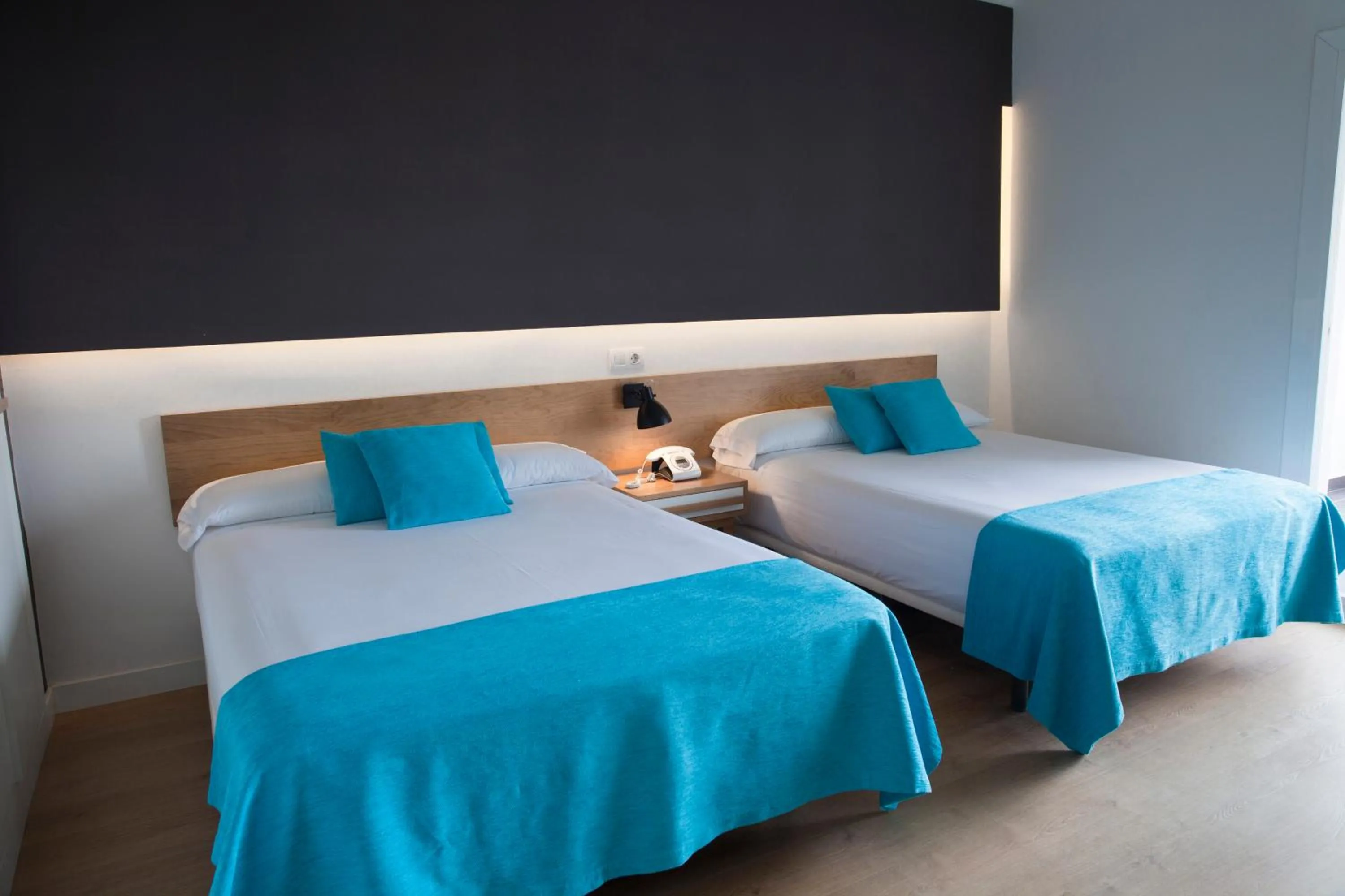 Bed in Hotel Brisamar Suites