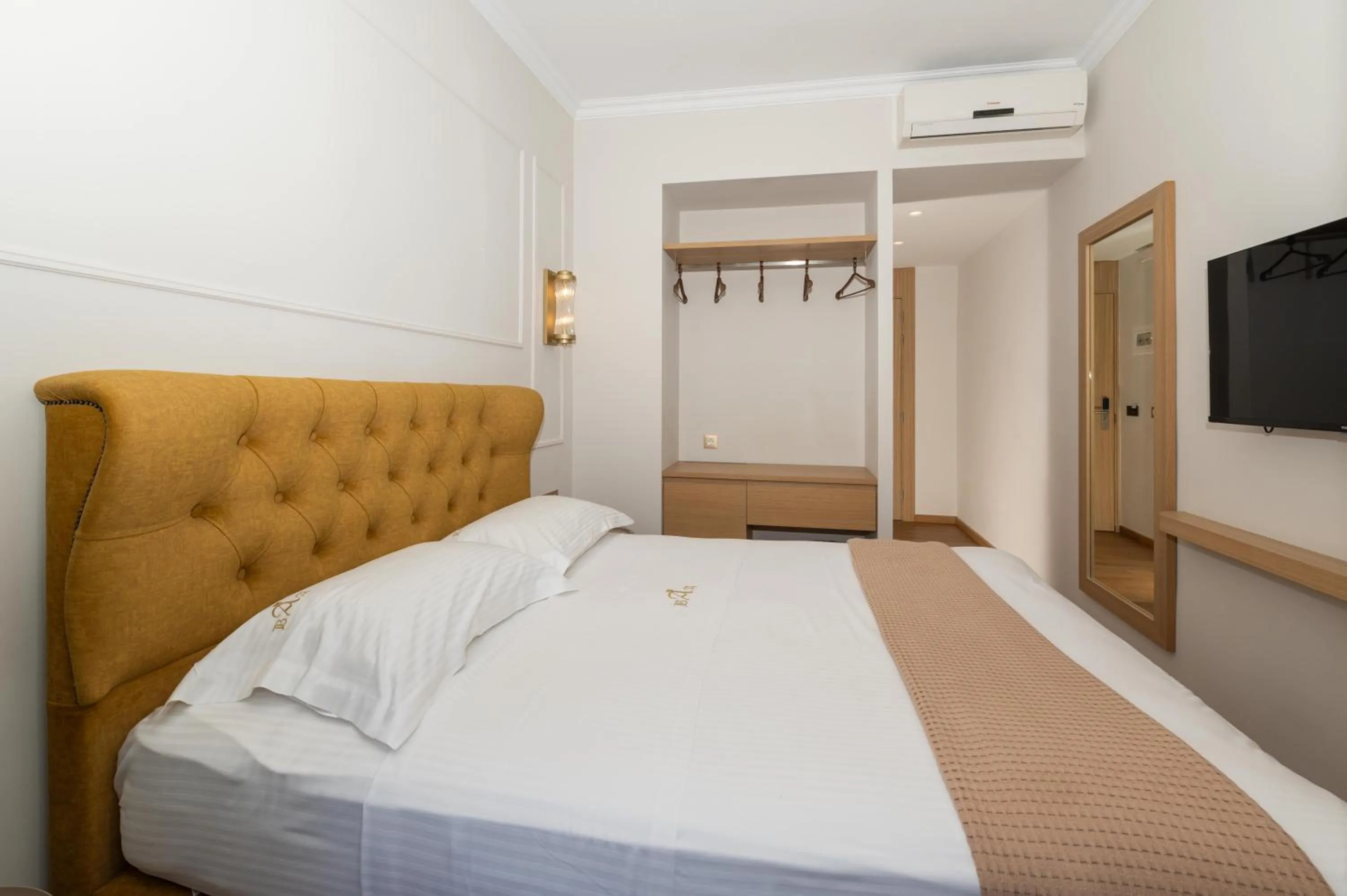 Bed in Aktaion City Hotel