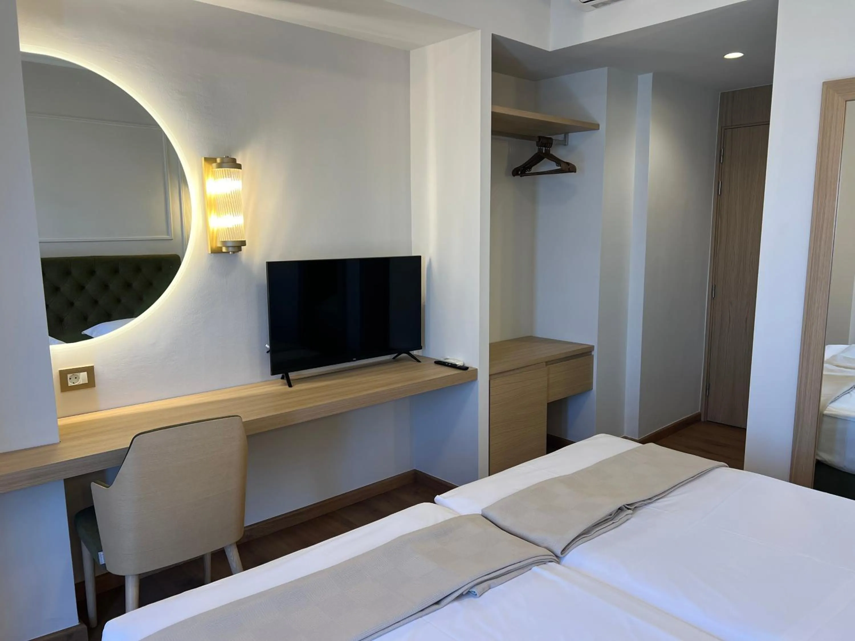 Bed in Aktaion City Hotel