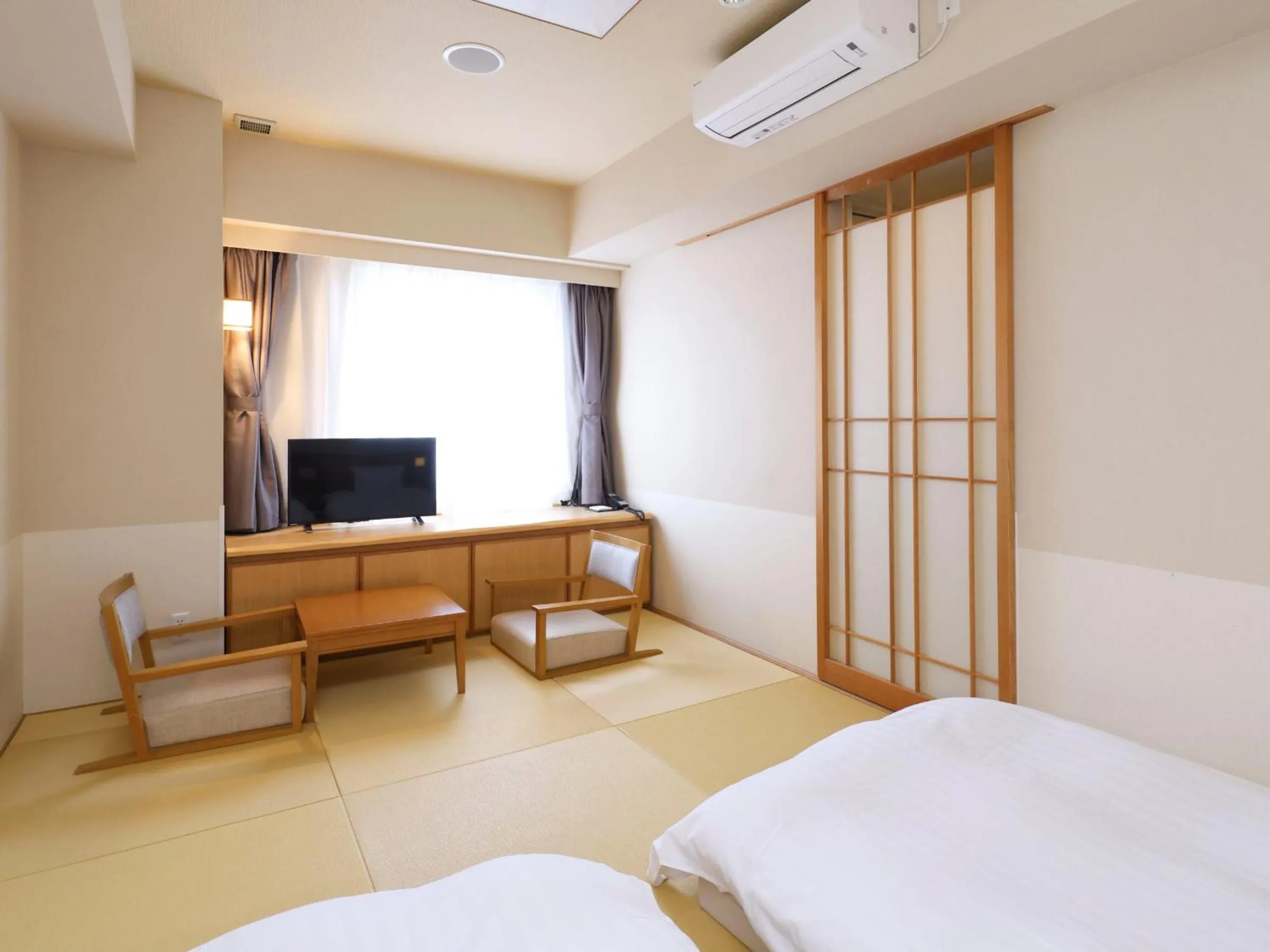 Bed in Dormy Inn Tsu