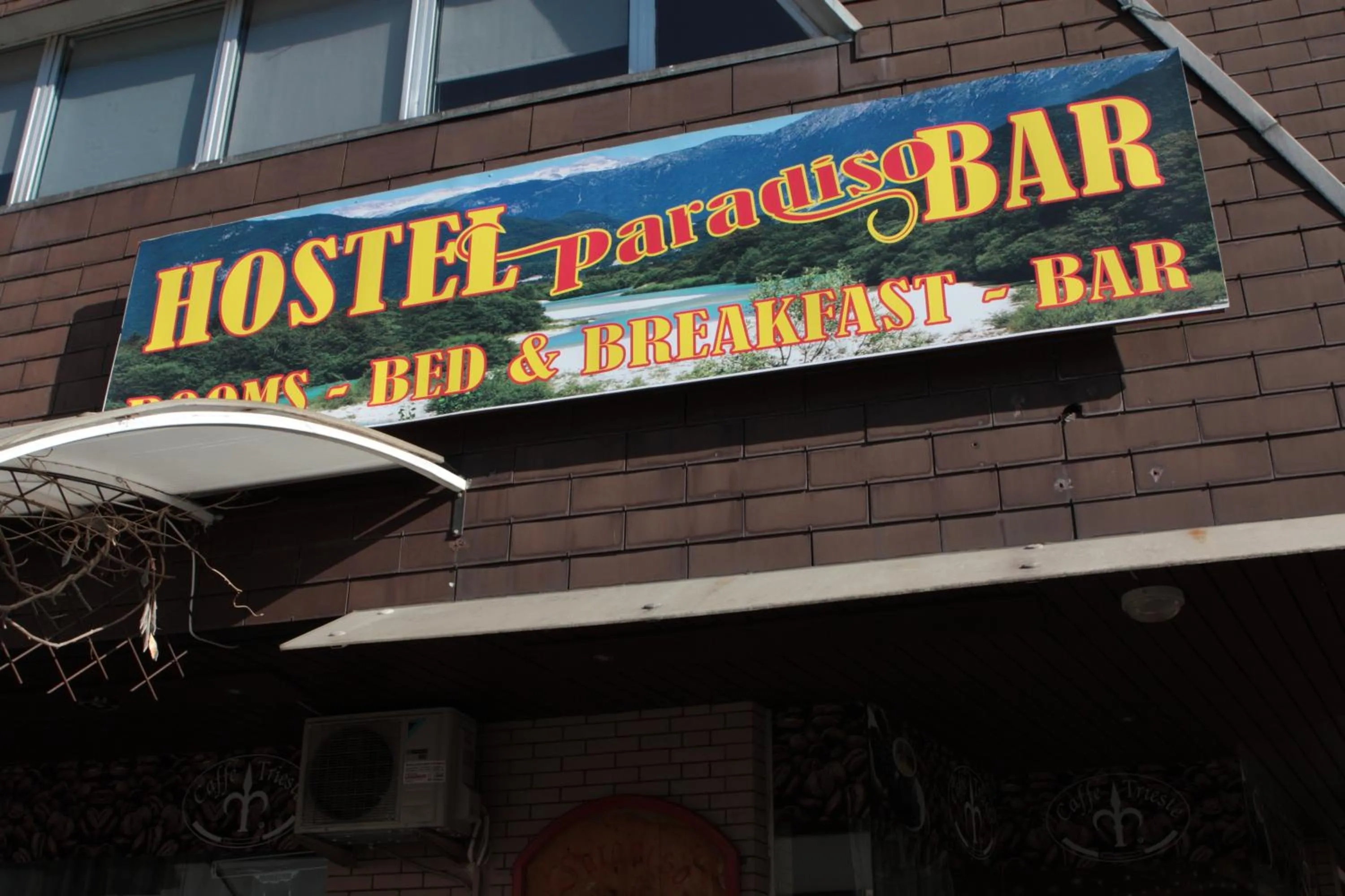 Property logo or sign in Hostel Paradiso