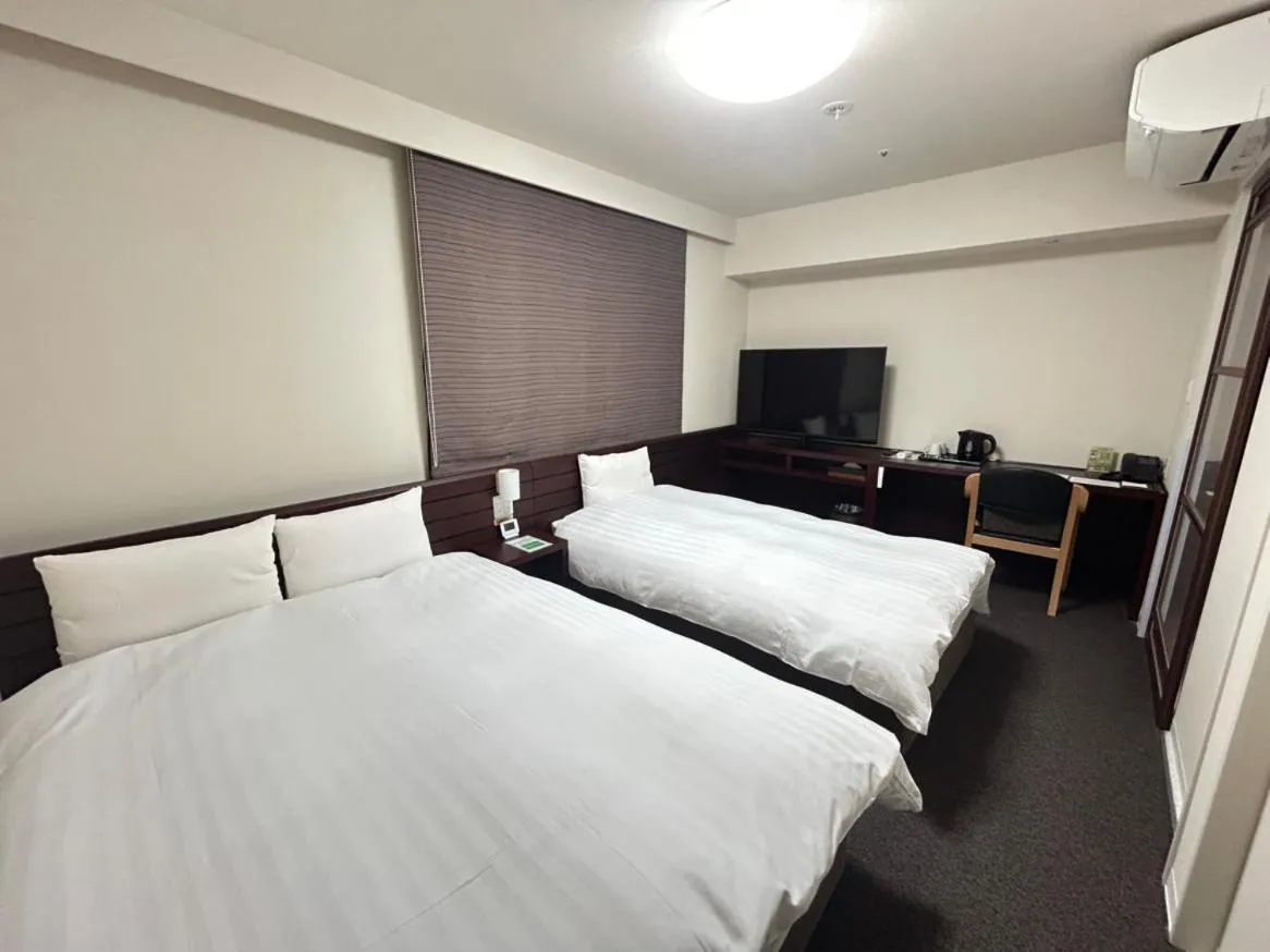 Bed in Dormy Inn Akita