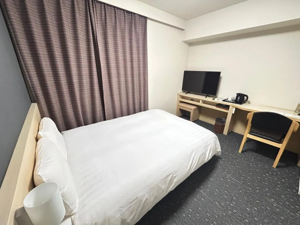 Bed in Dormy Inn Akita
