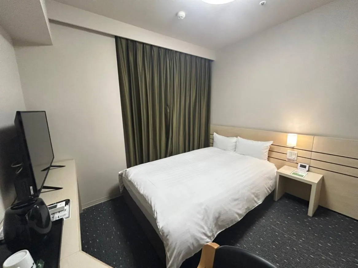 Bed in Dormy Inn Akita