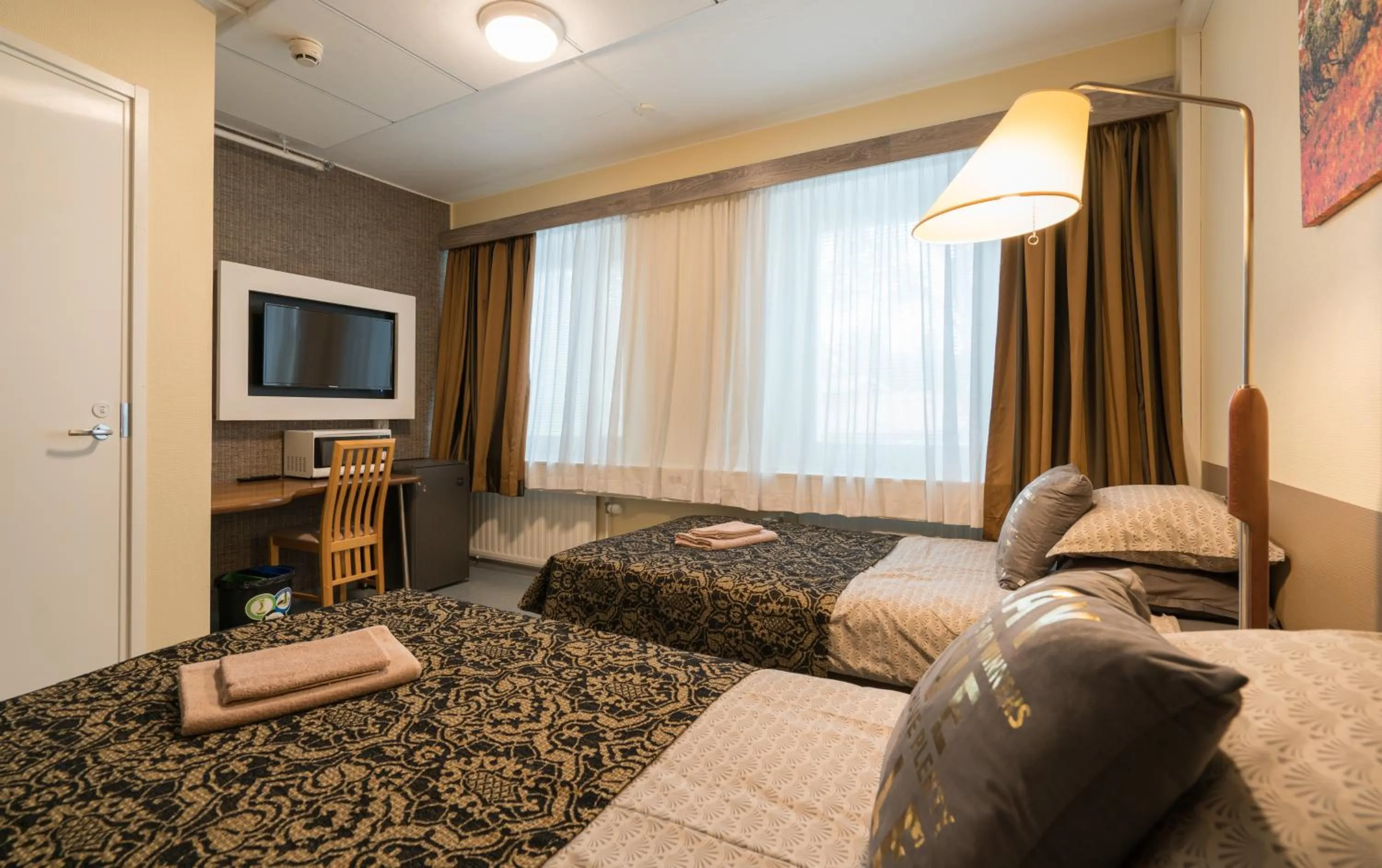 Photo of the whole room, Bed in Gasthaus Patruuna