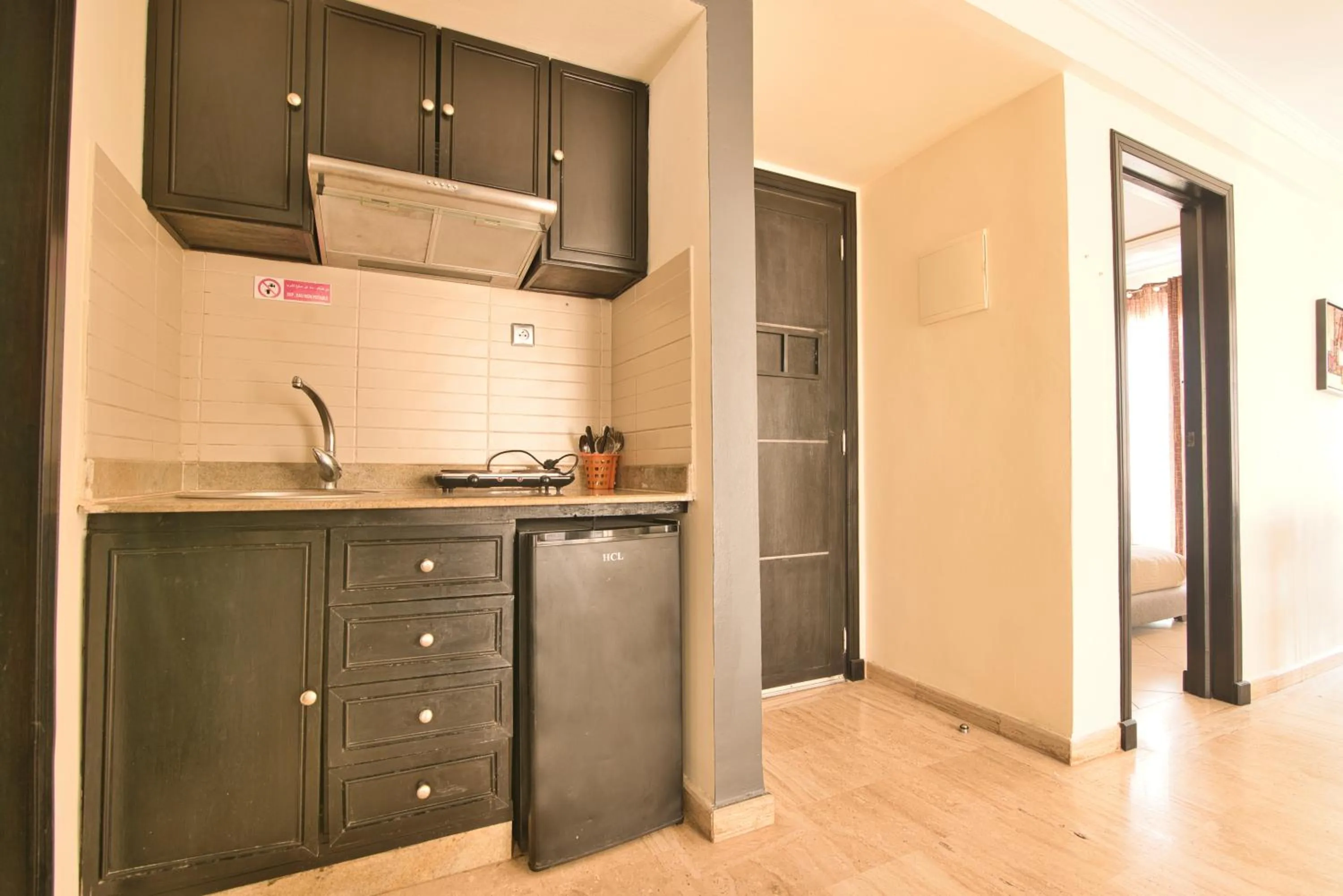 Kitchen or kitchenette in Appart Hôtel Founty Beach