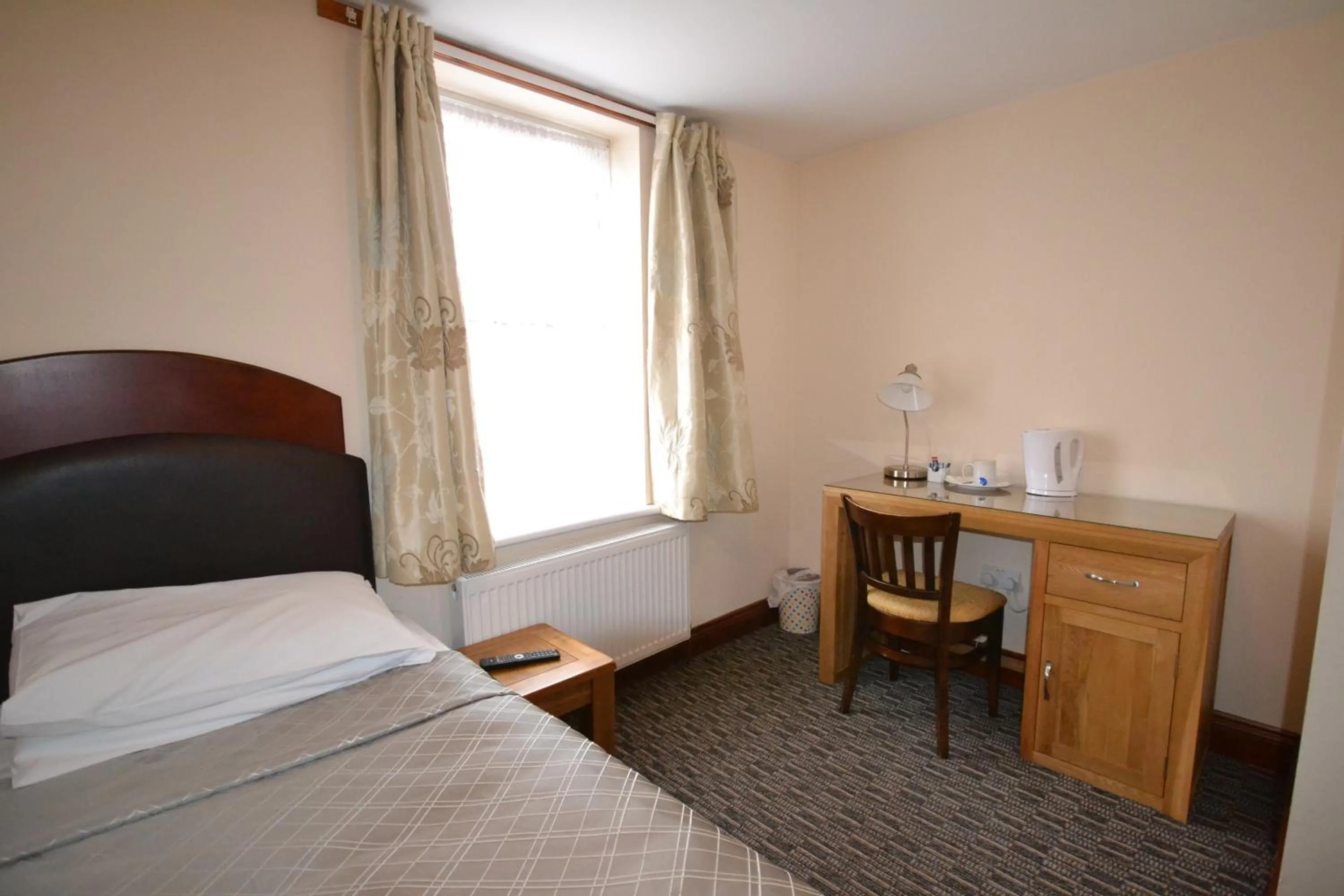 Bed in Airport Guest House