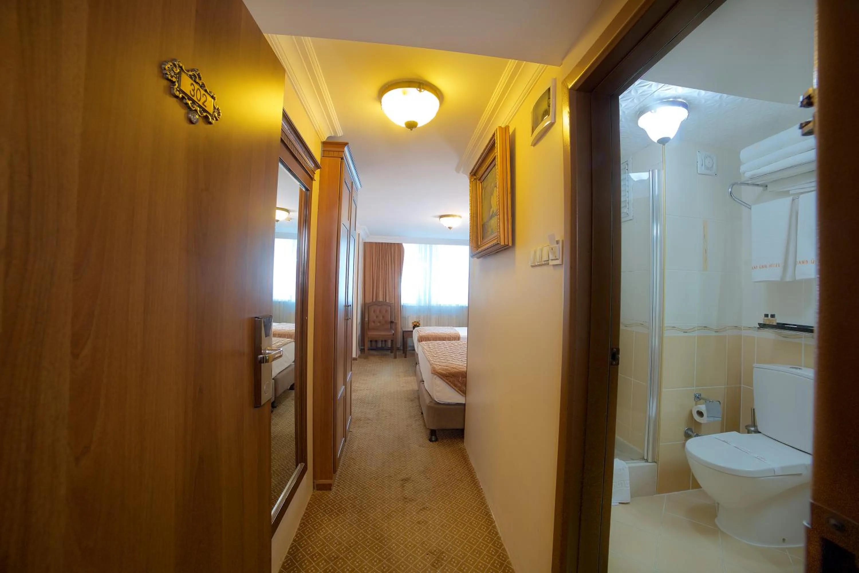 Photo of the whole room, Bed in Grand Unal Hotel