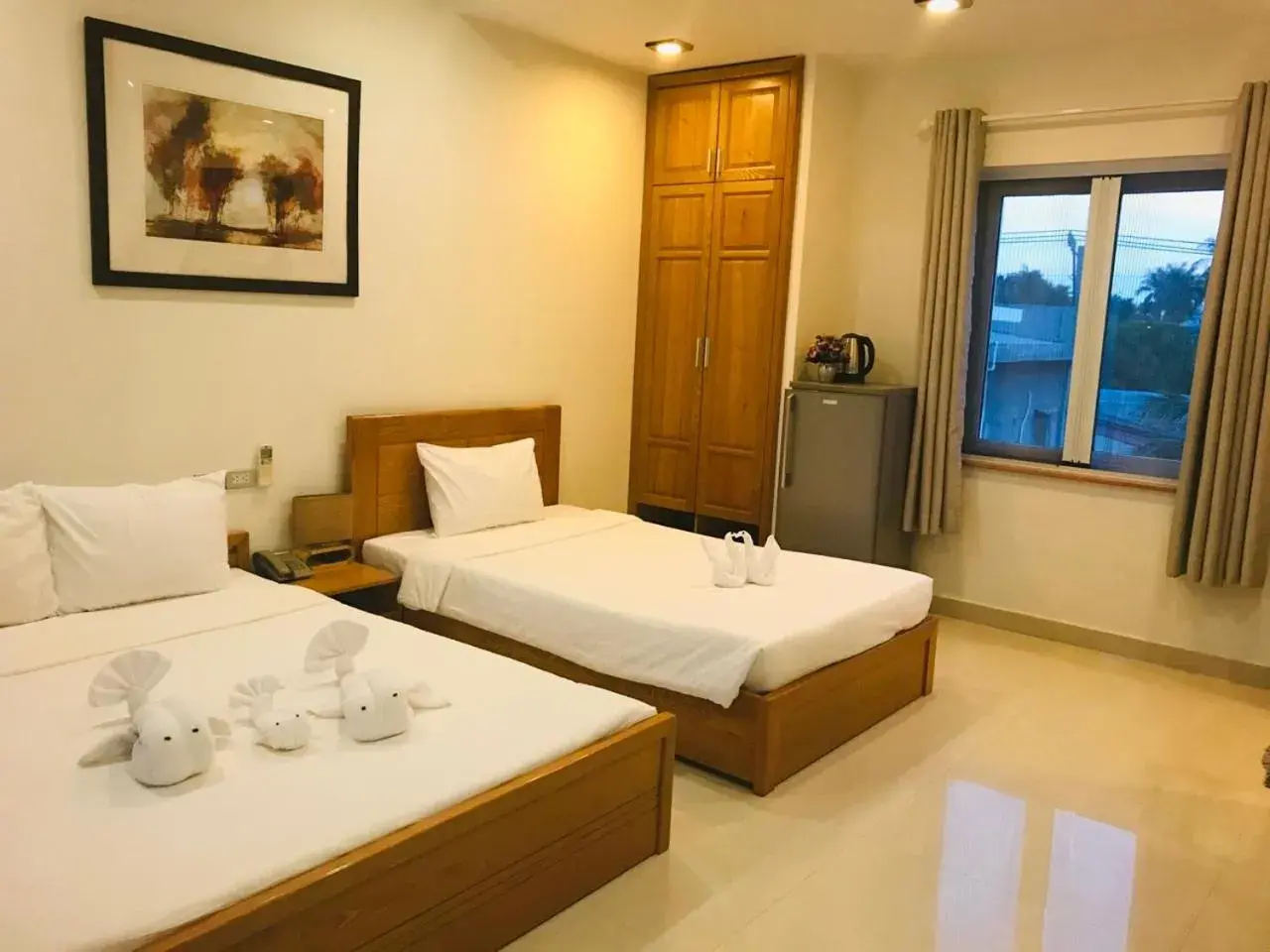 Triple Room with Pool View in Qli Hotel Muine Triple Room with Pool View in Qli Hotel Muine