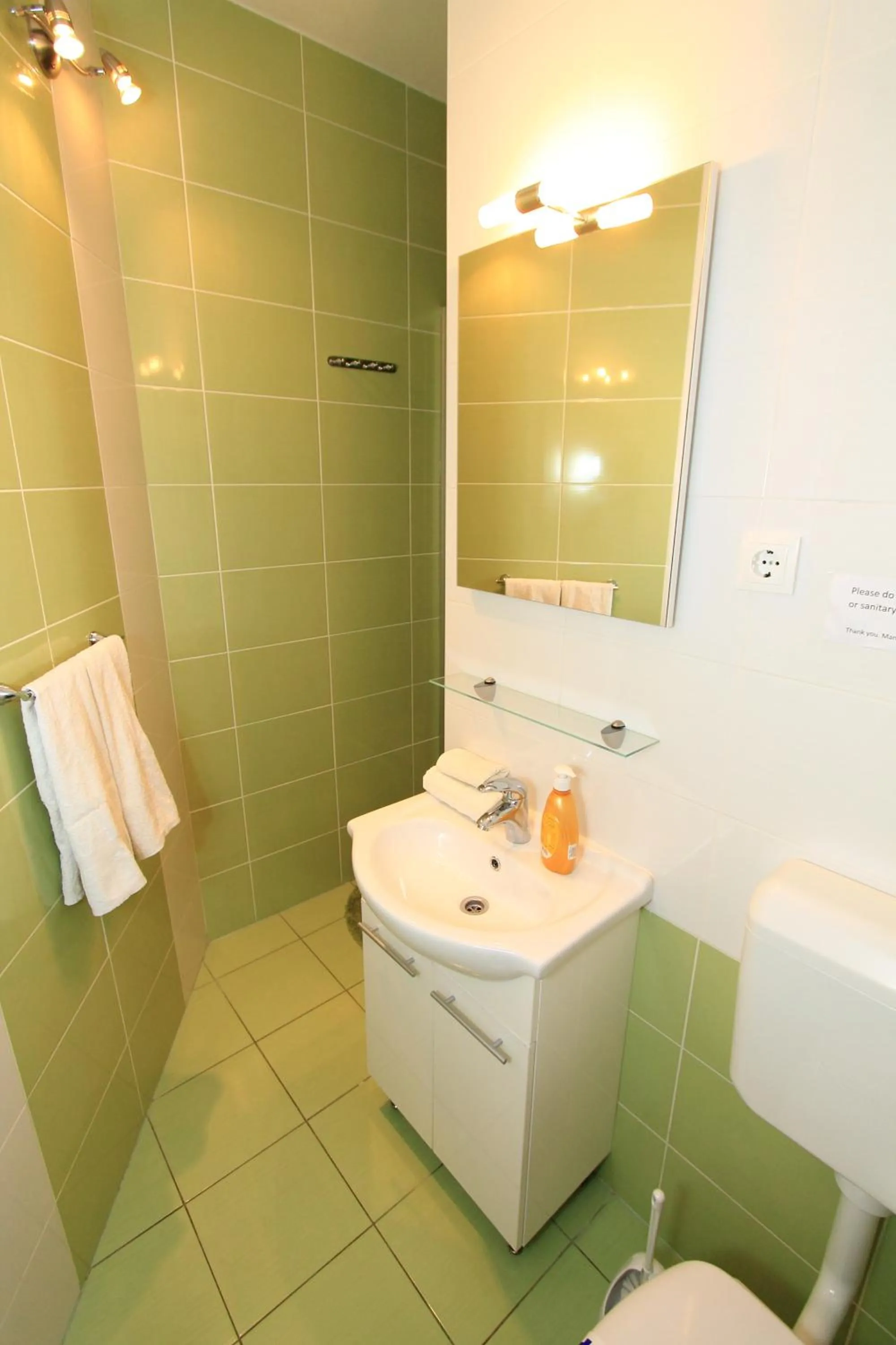 Bathroom in Nirvana Rooms & Apartments