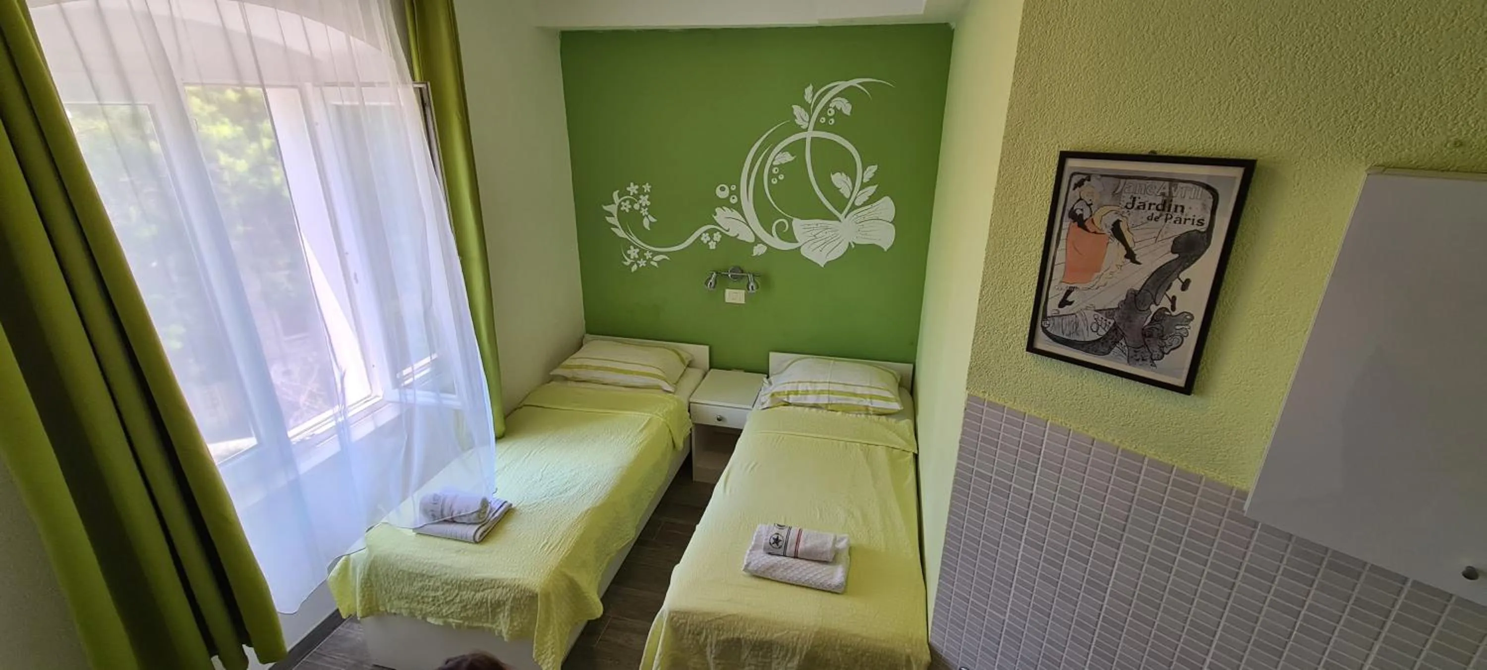 Bed in Nirvana Rooms & Apartments