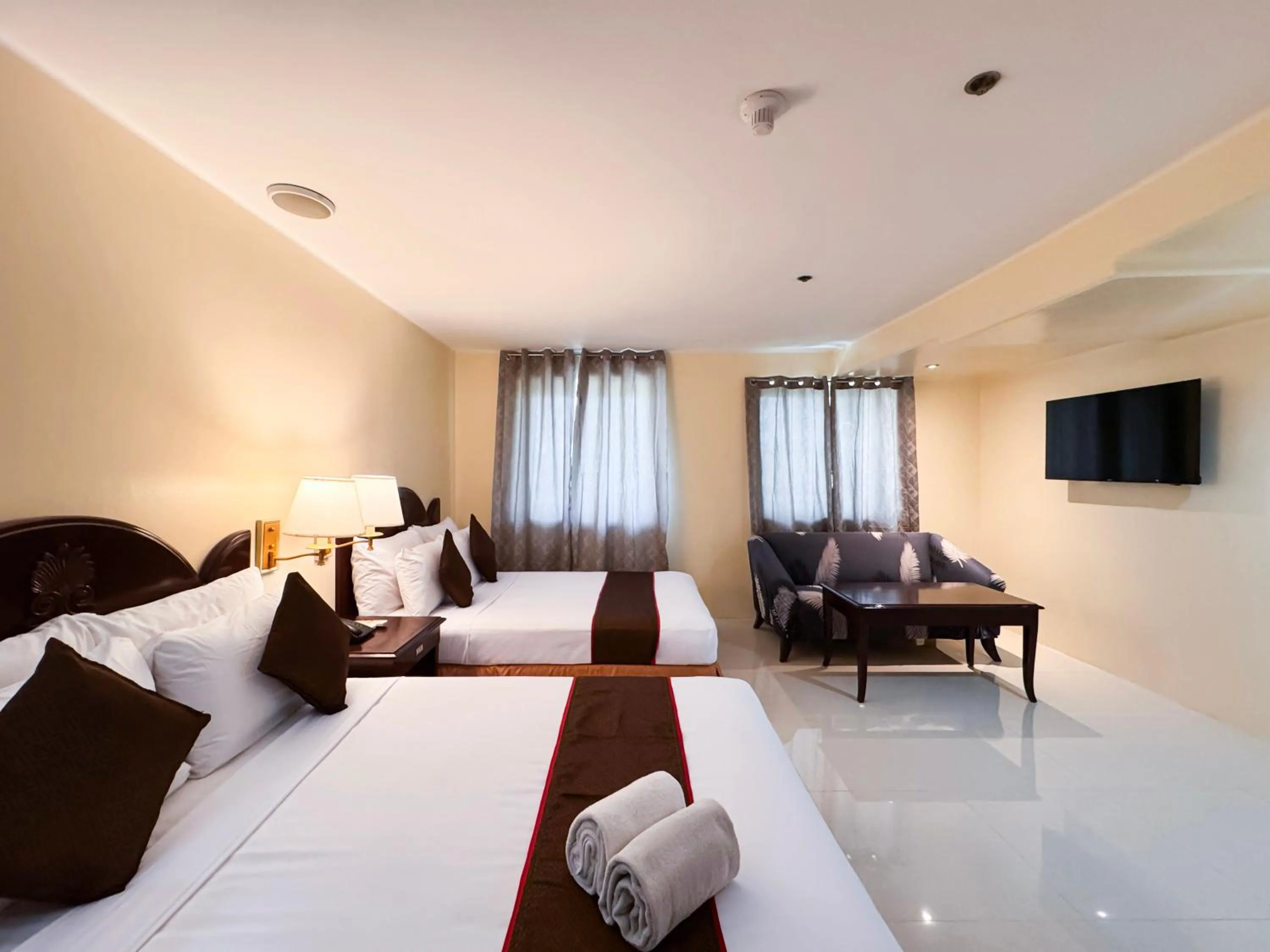 Bed in Palladium Suites Hotel