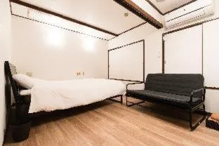 Bed in Tokyo Guest House Ouji Music Lounge