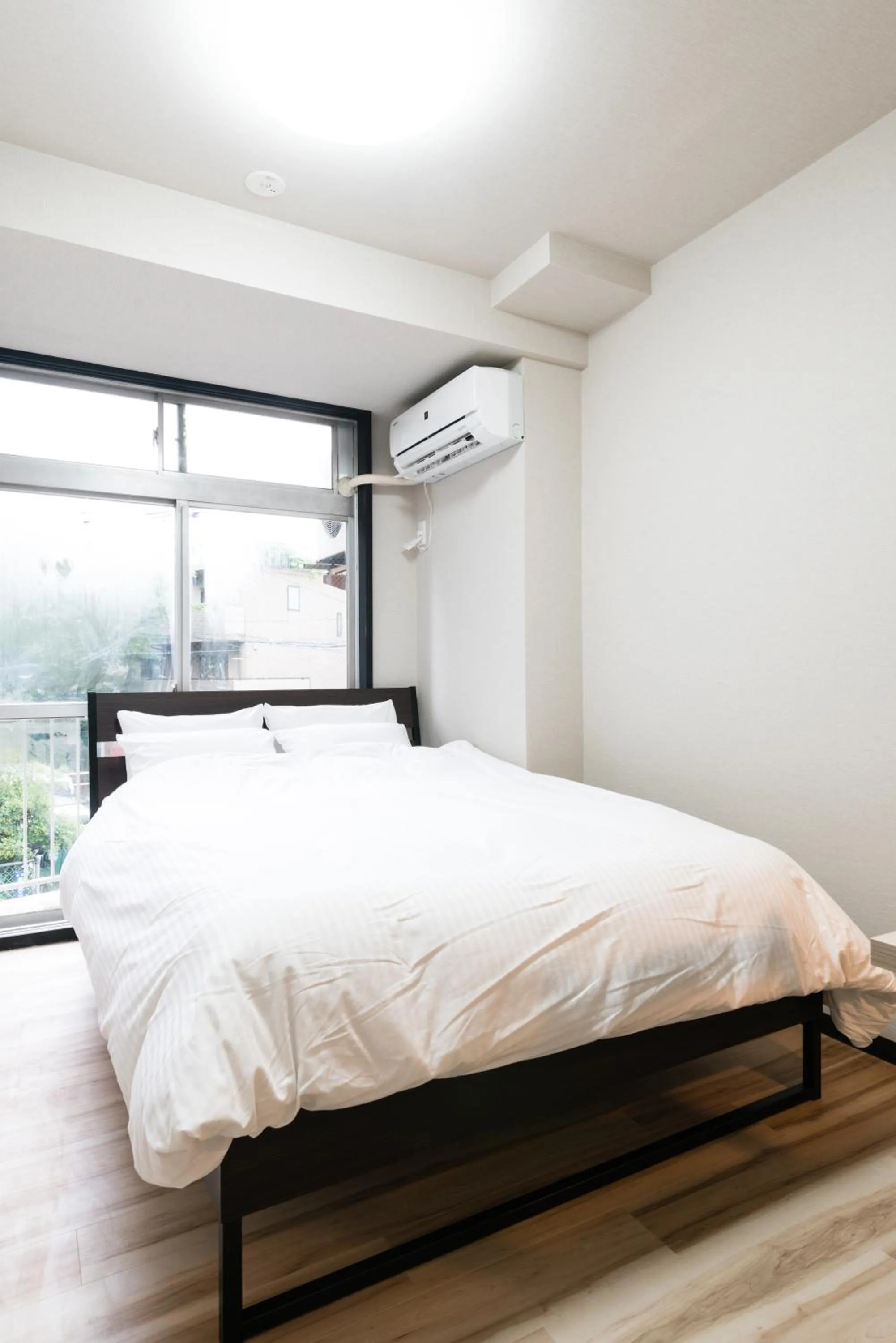 Bed in Tokyo Guest House Ouji Music Lounge