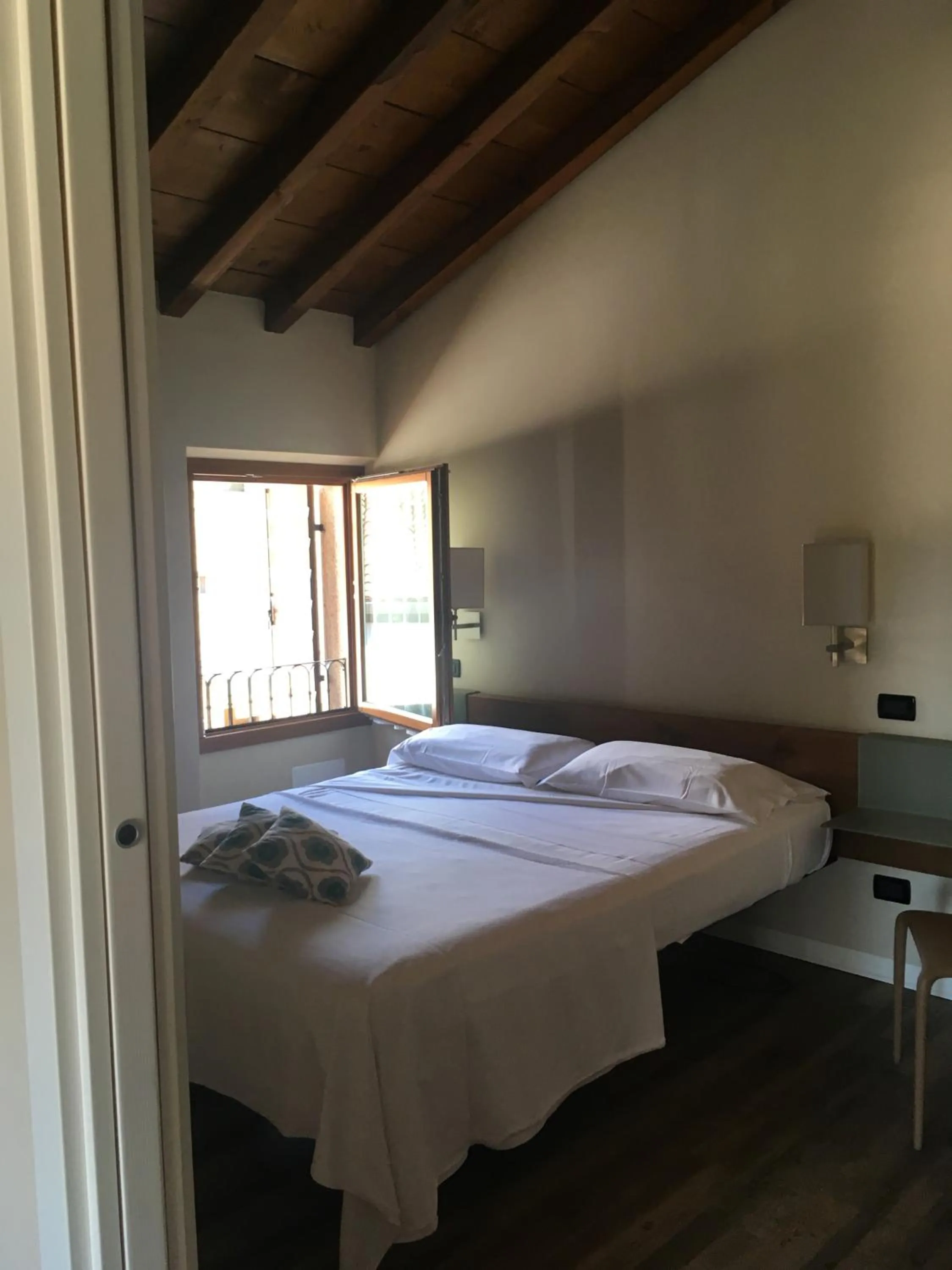 Bed in Corte San Luca Apartments
