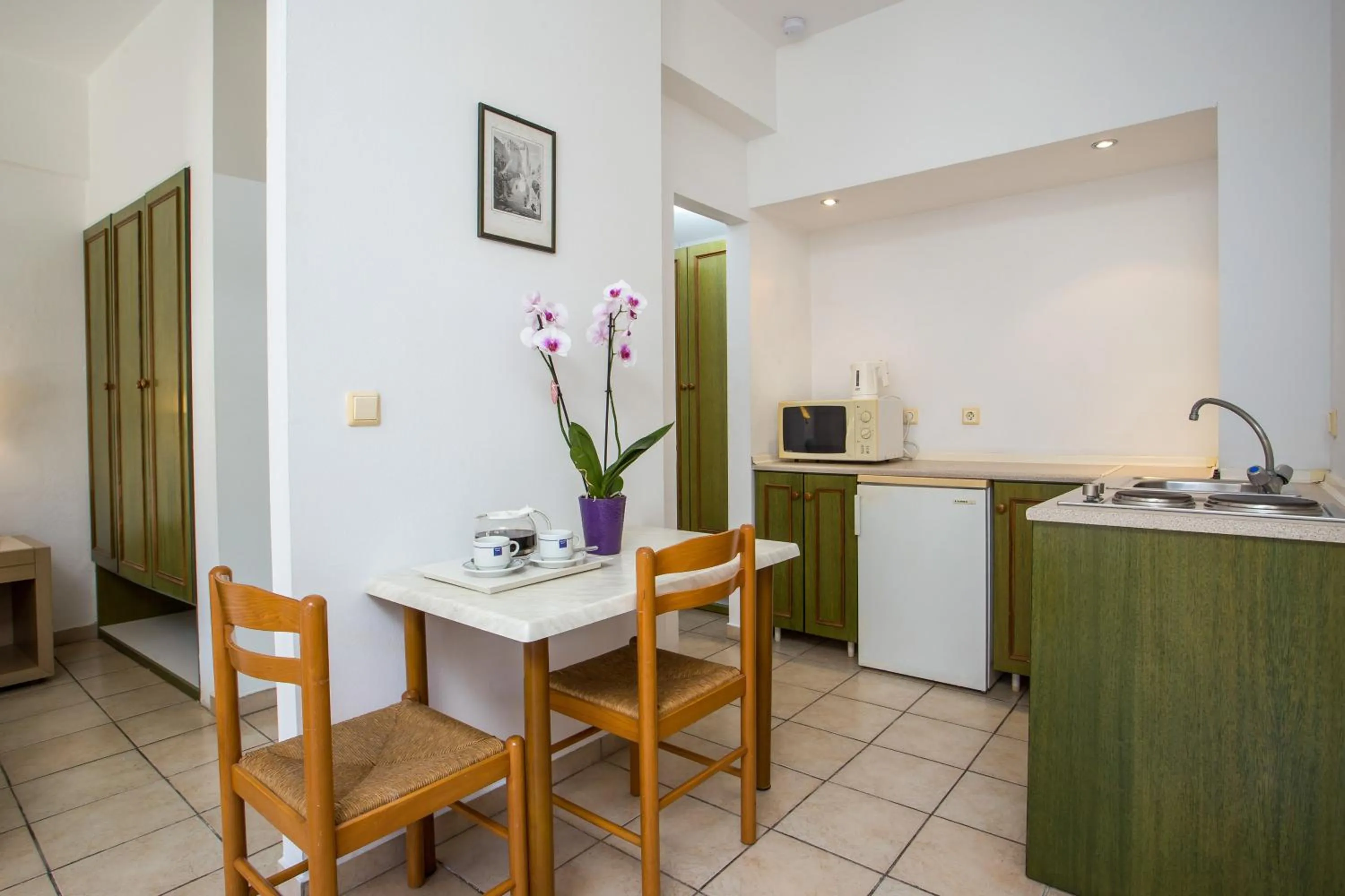 Kitchen or kitchenette in Royal Aparthotel City Centre