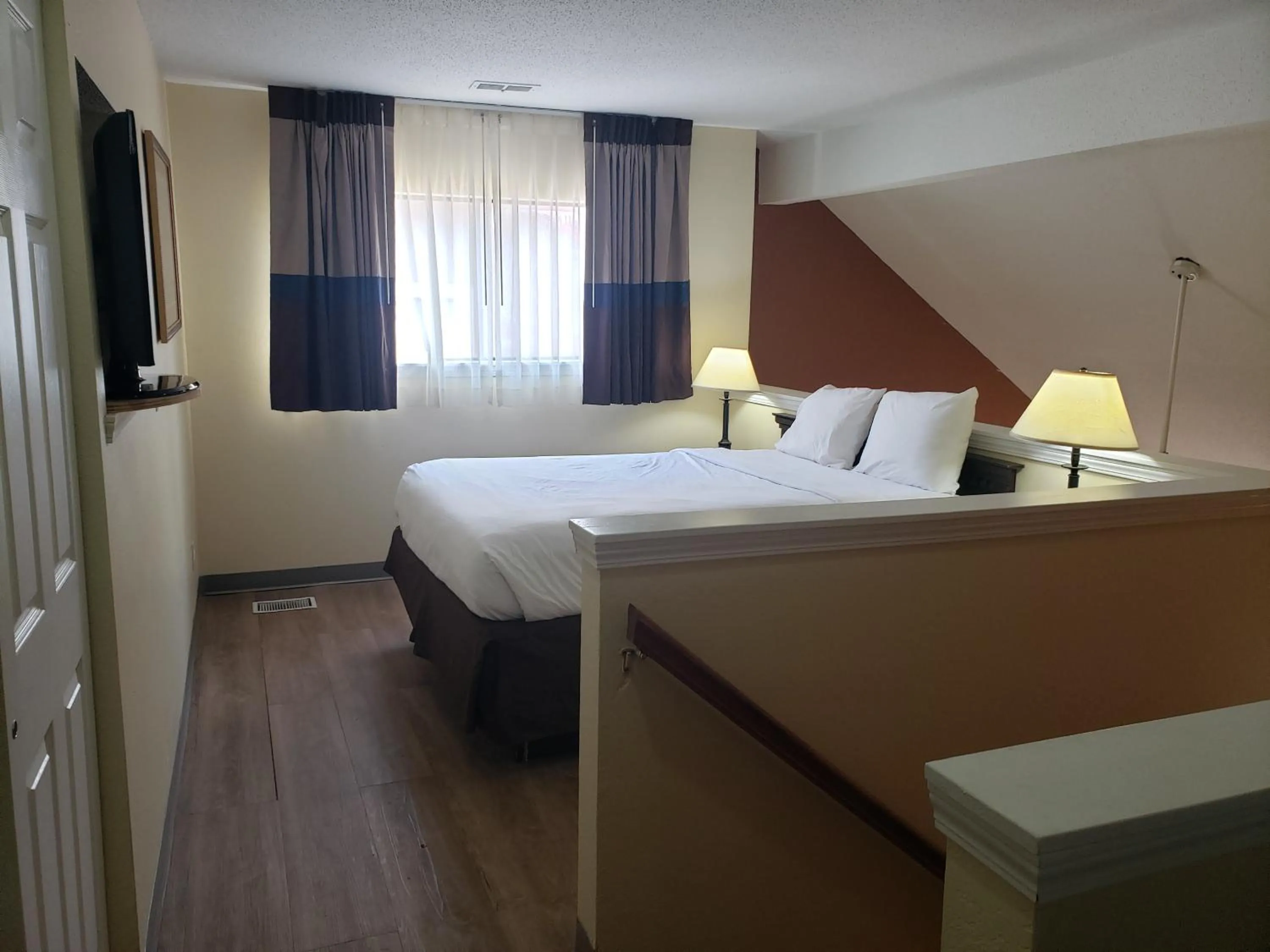 Bed in Affordable Suites of America Grand Rapids