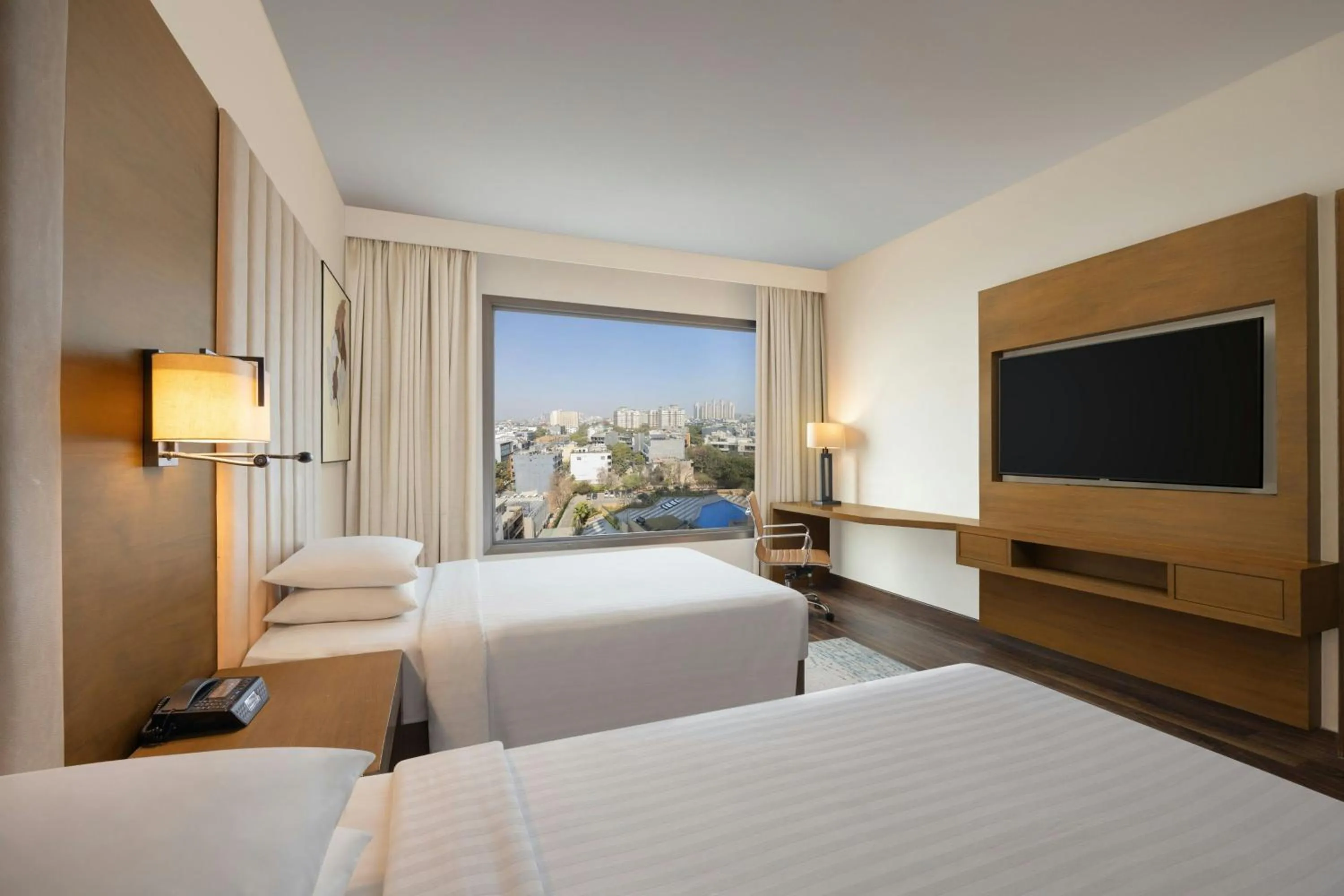 Swimming pool, Bed in Courtyard by Marriott Gurugram Downtown