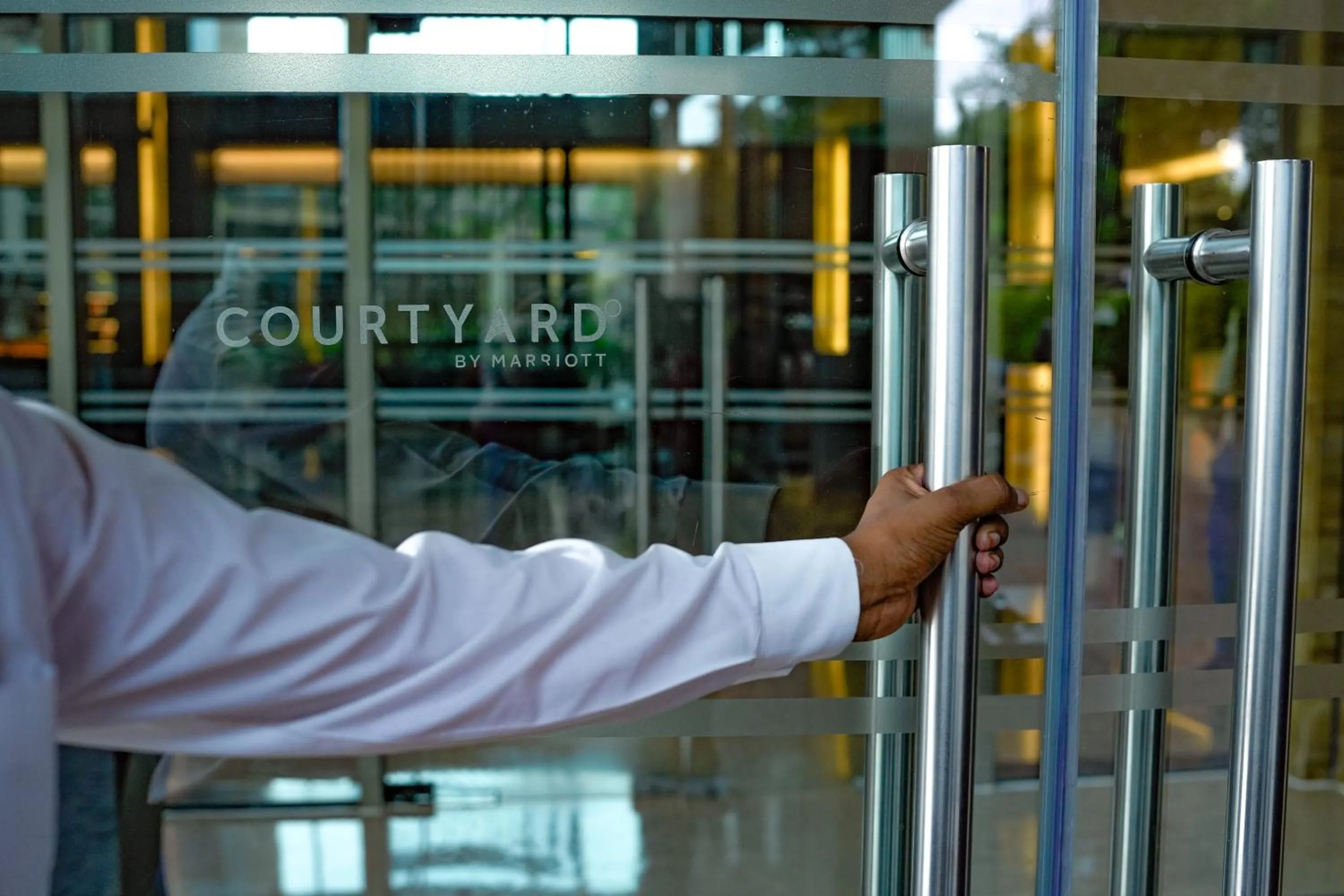 Text overlay in Courtyard by Marriott Gurugram Downtown