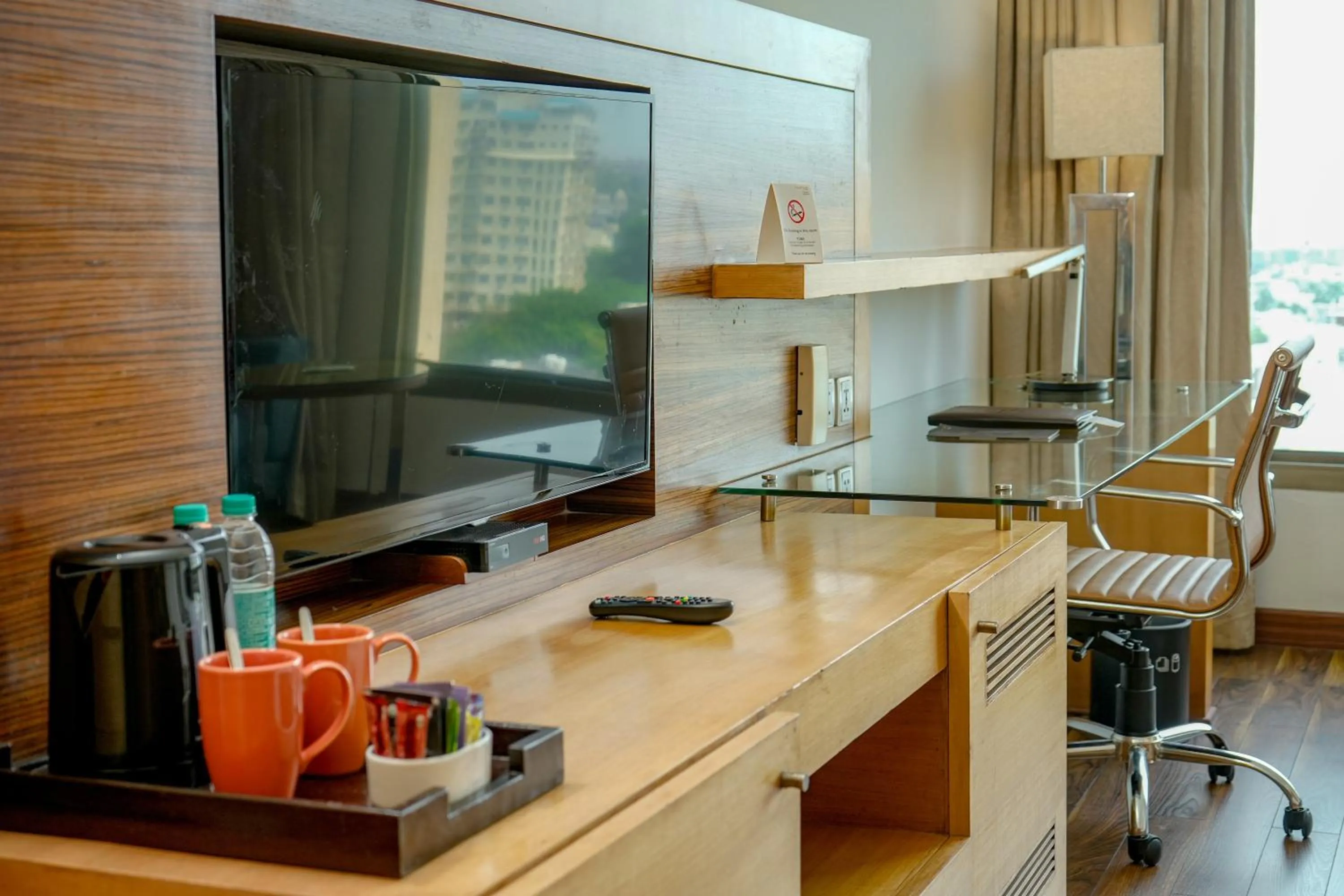 TV and multimedia in Courtyard by Marriott Gurugram Downtown