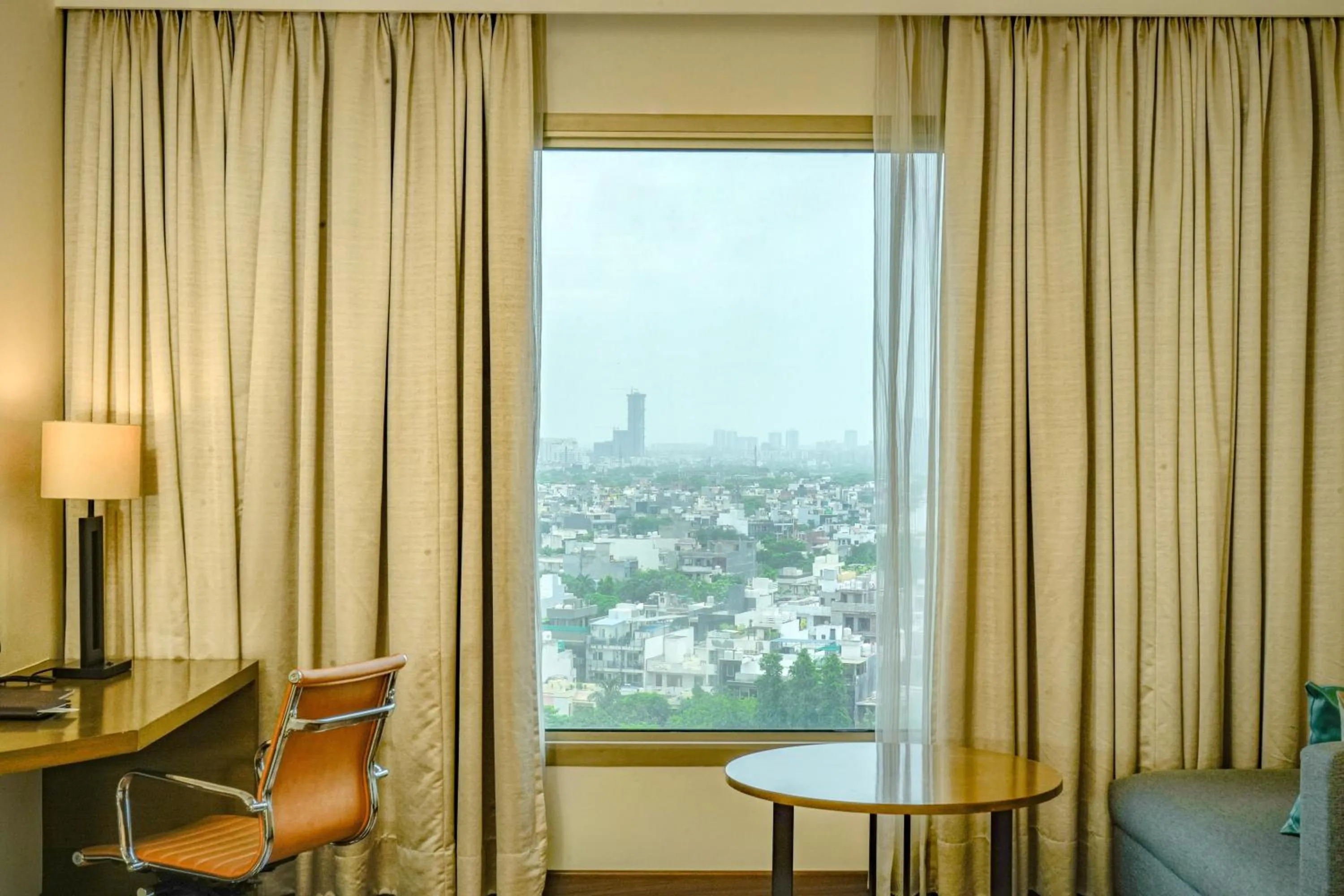 Seating area in Courtyard by Marriott Gurugram Downtown