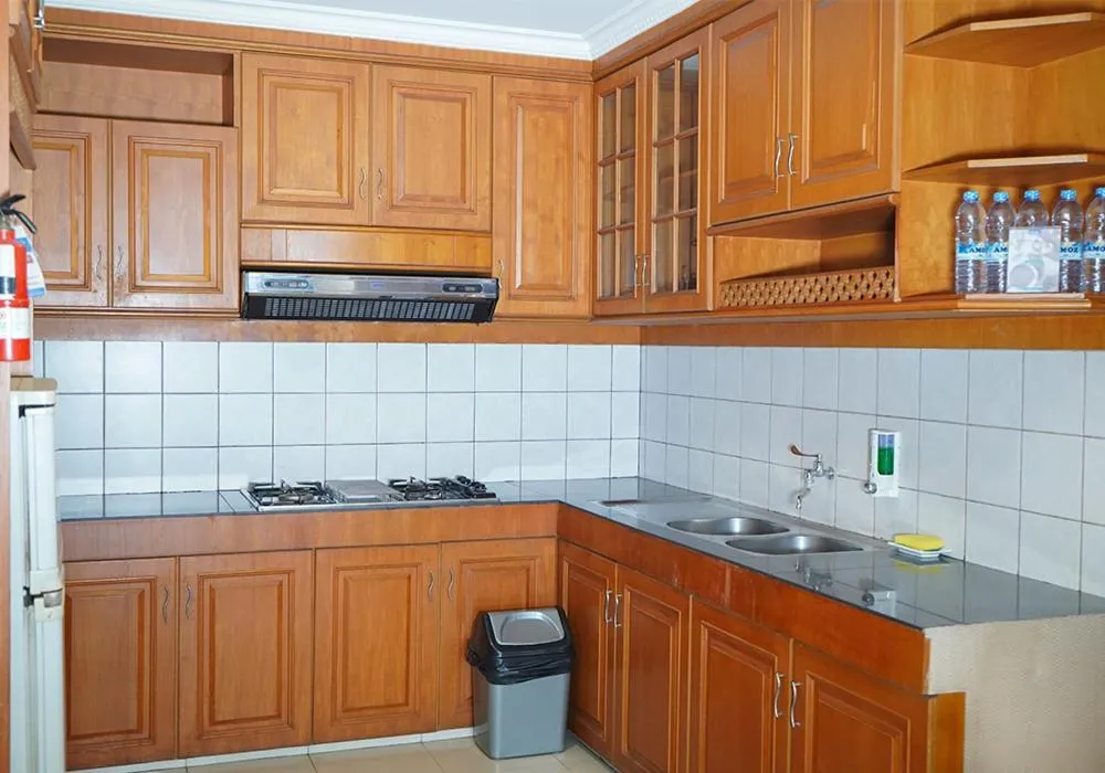Kitchen or kitchenette in Travellers Suites Serviced Apartments