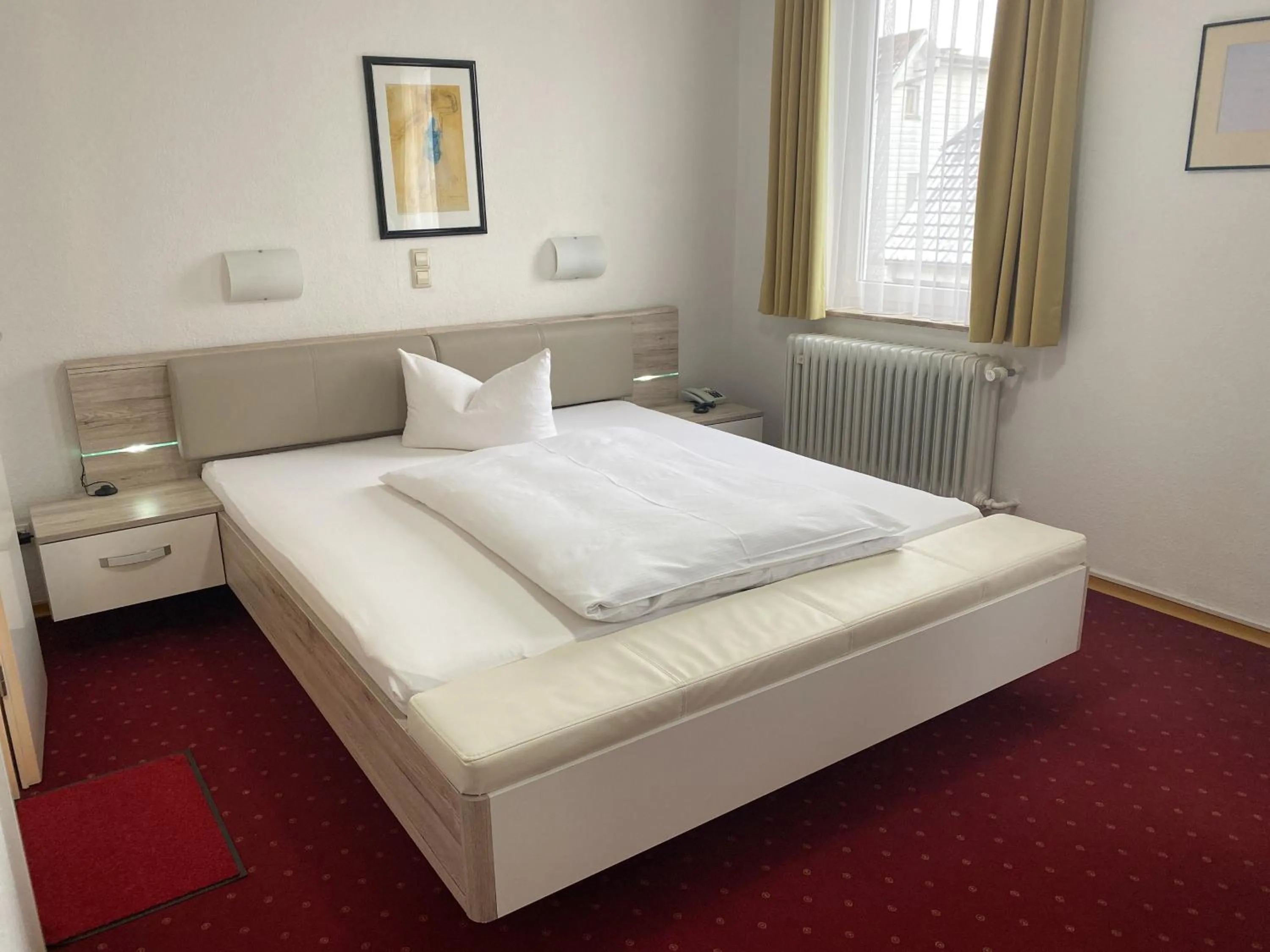 Photo of the whole room, Bed in Hotel Rosengarten Tuttlingen