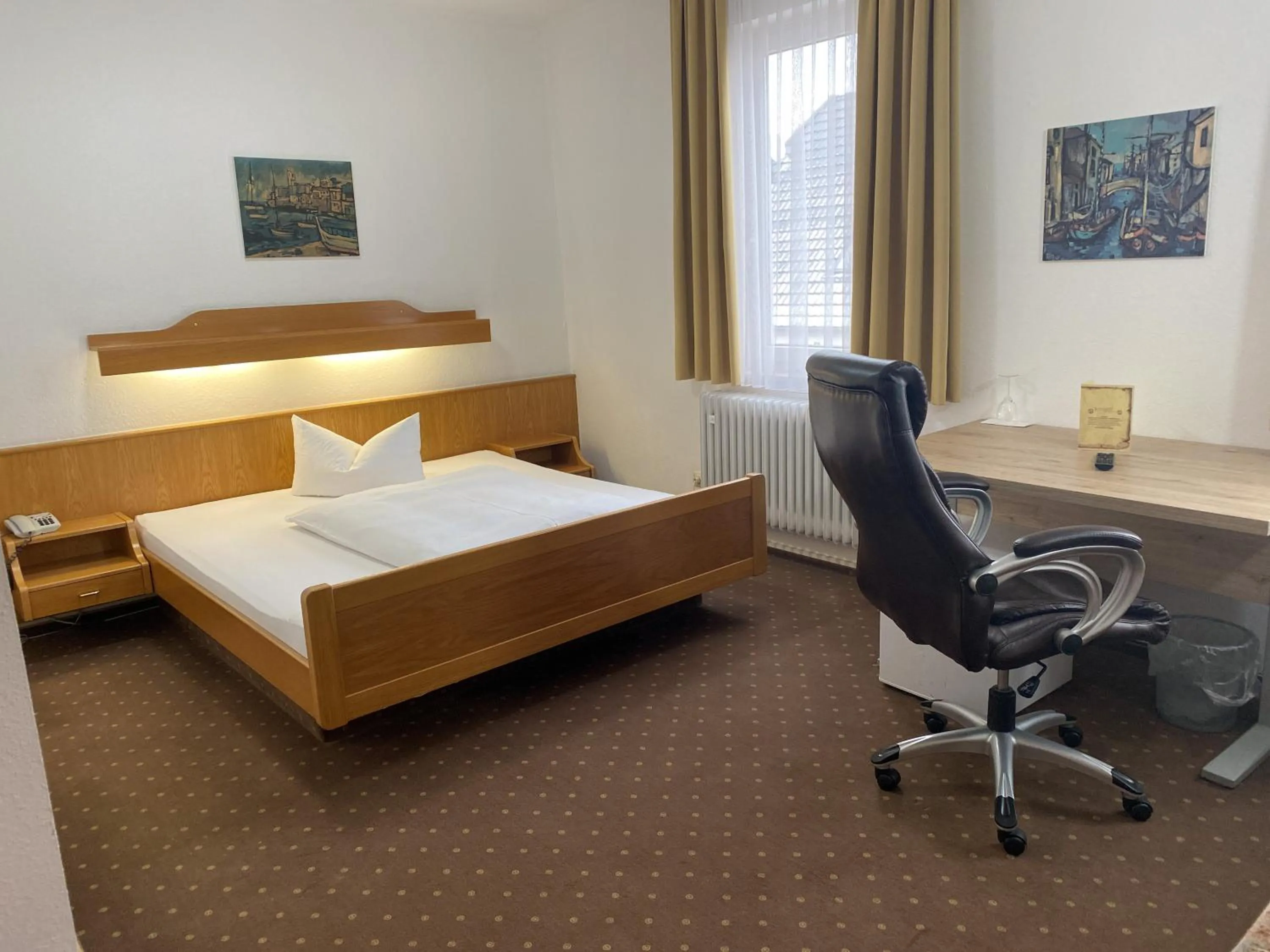 Photo of the whole room, Bed in Hotel Rosengarten Tuttlingen