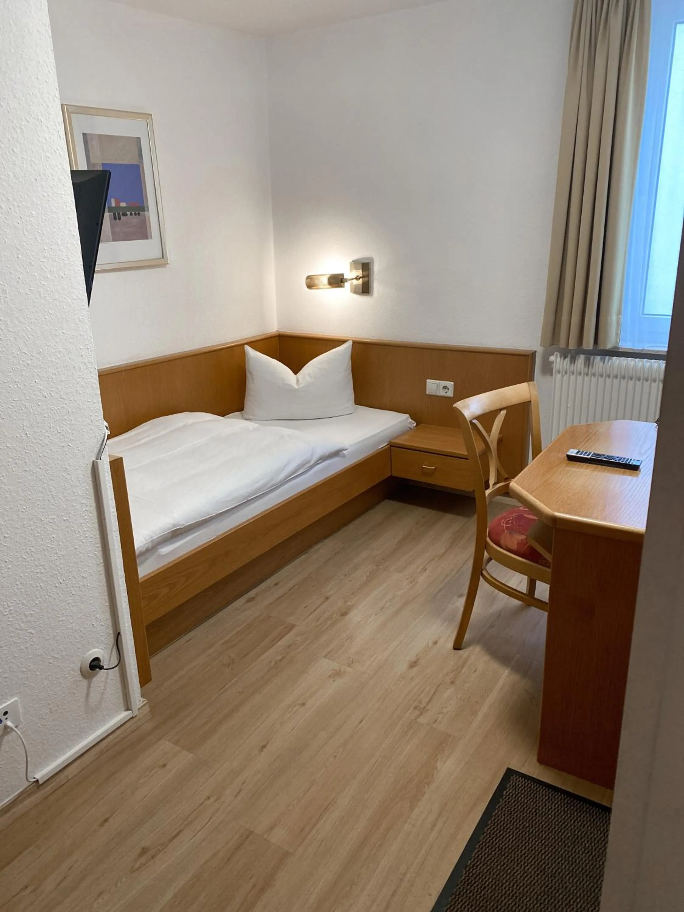 Photo of the whole room, Bed in Hotel Rosengarten Tuttlingen