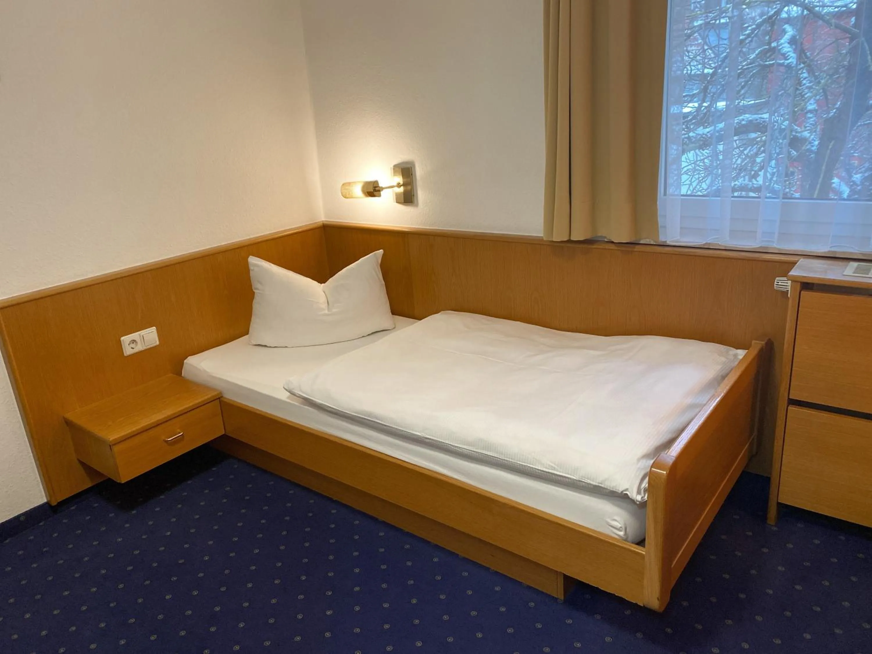 Photo of the whole room, Bed in Hotel Rosengarten Tuttlingen