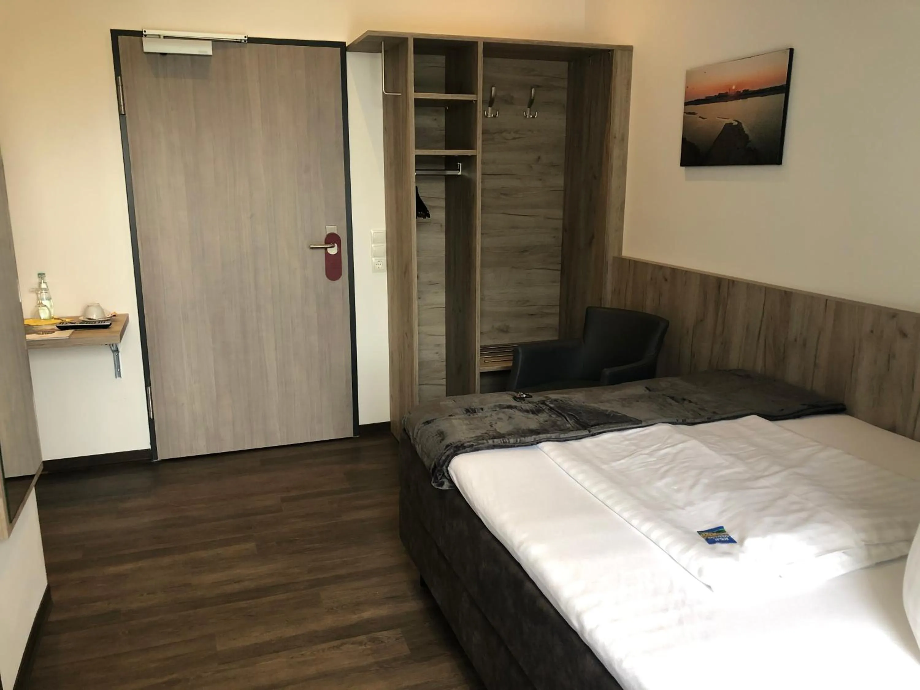 Photo of the whole room, Bed in WH Hotels Papenburg Zentrum