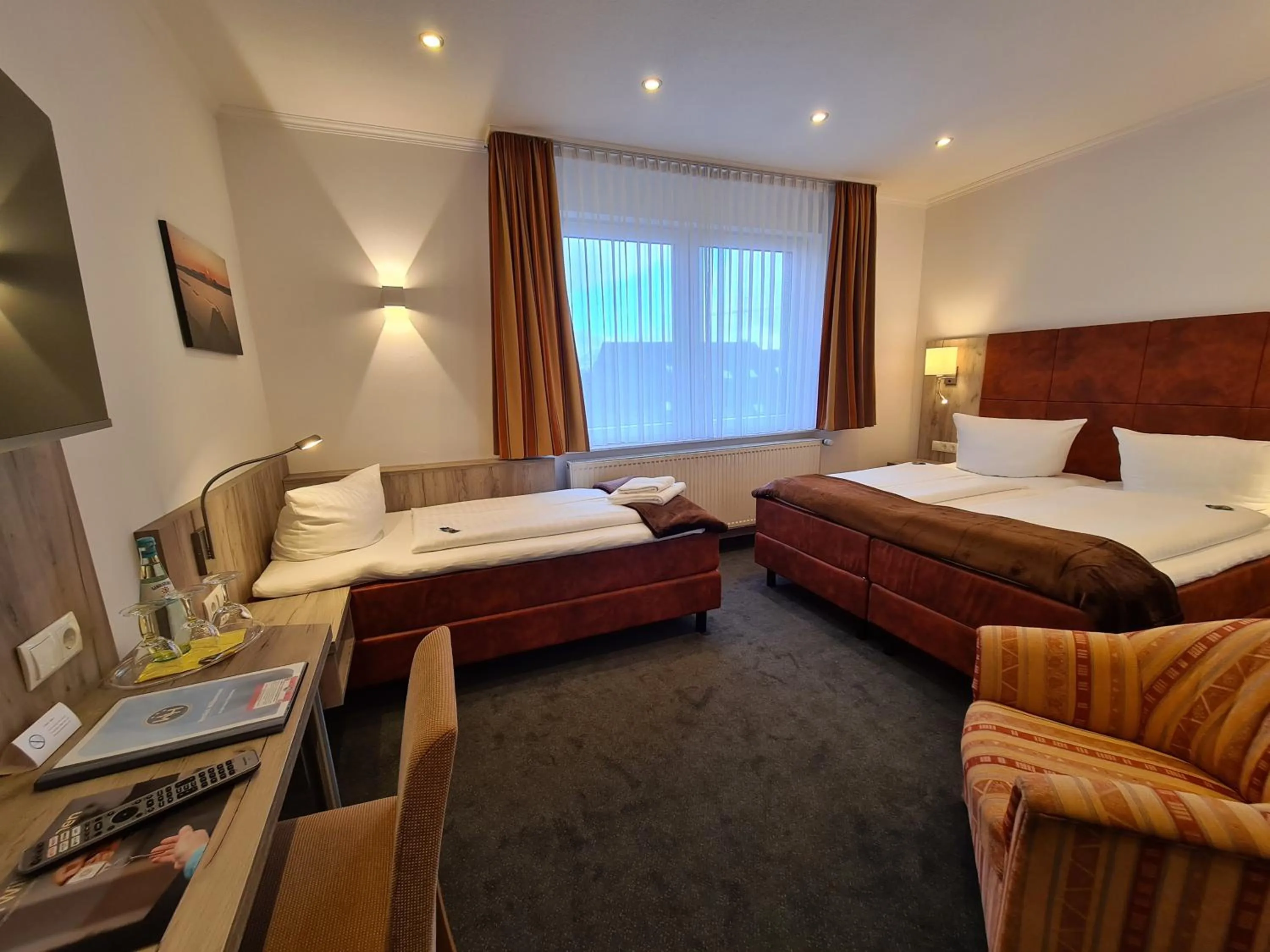 Photo of the whole room, Bed in WH Hotels Papenburg Zentrum