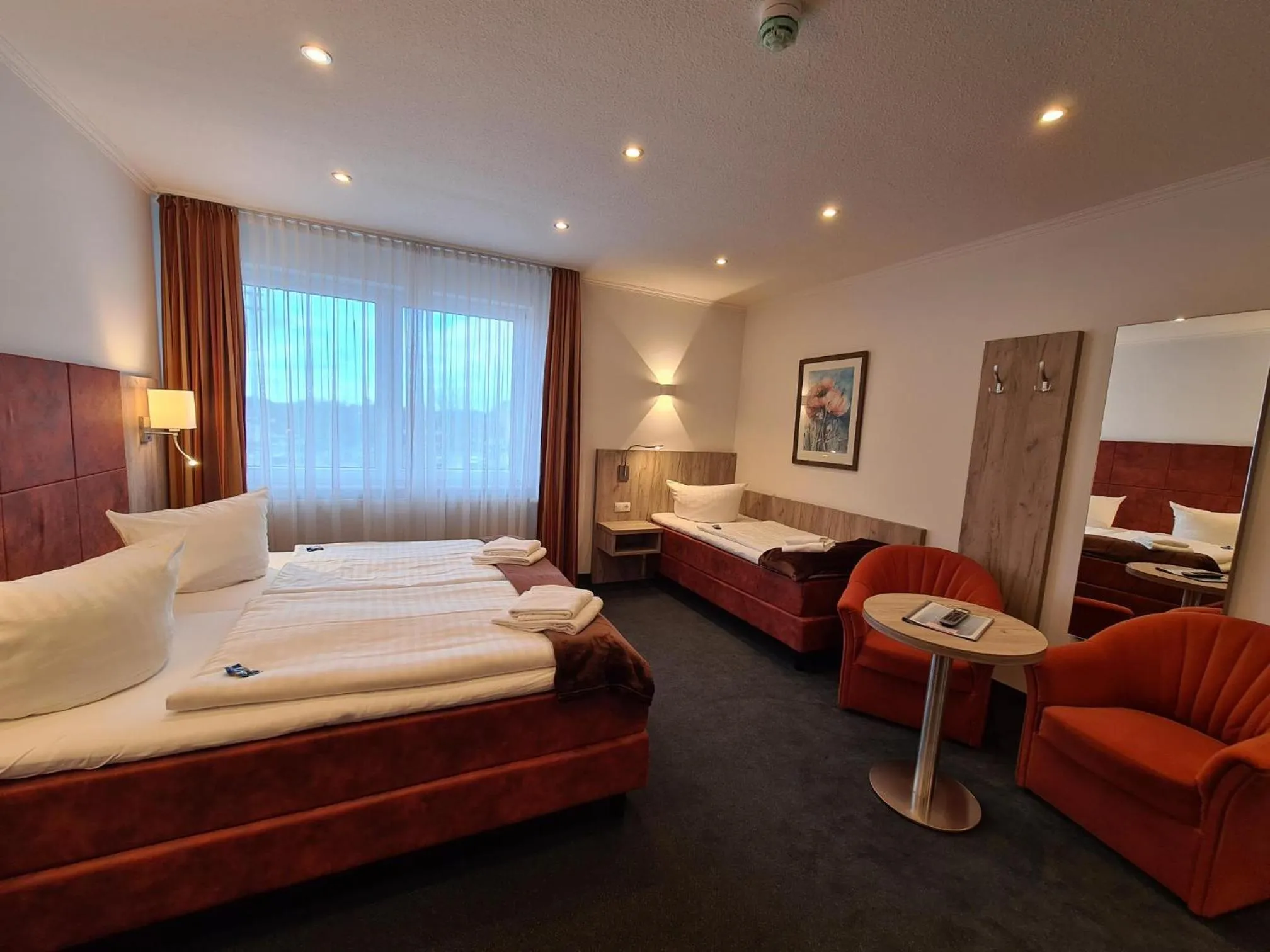 Photo of the whole room, Bed in WH Hotels Papenburg Zentrum