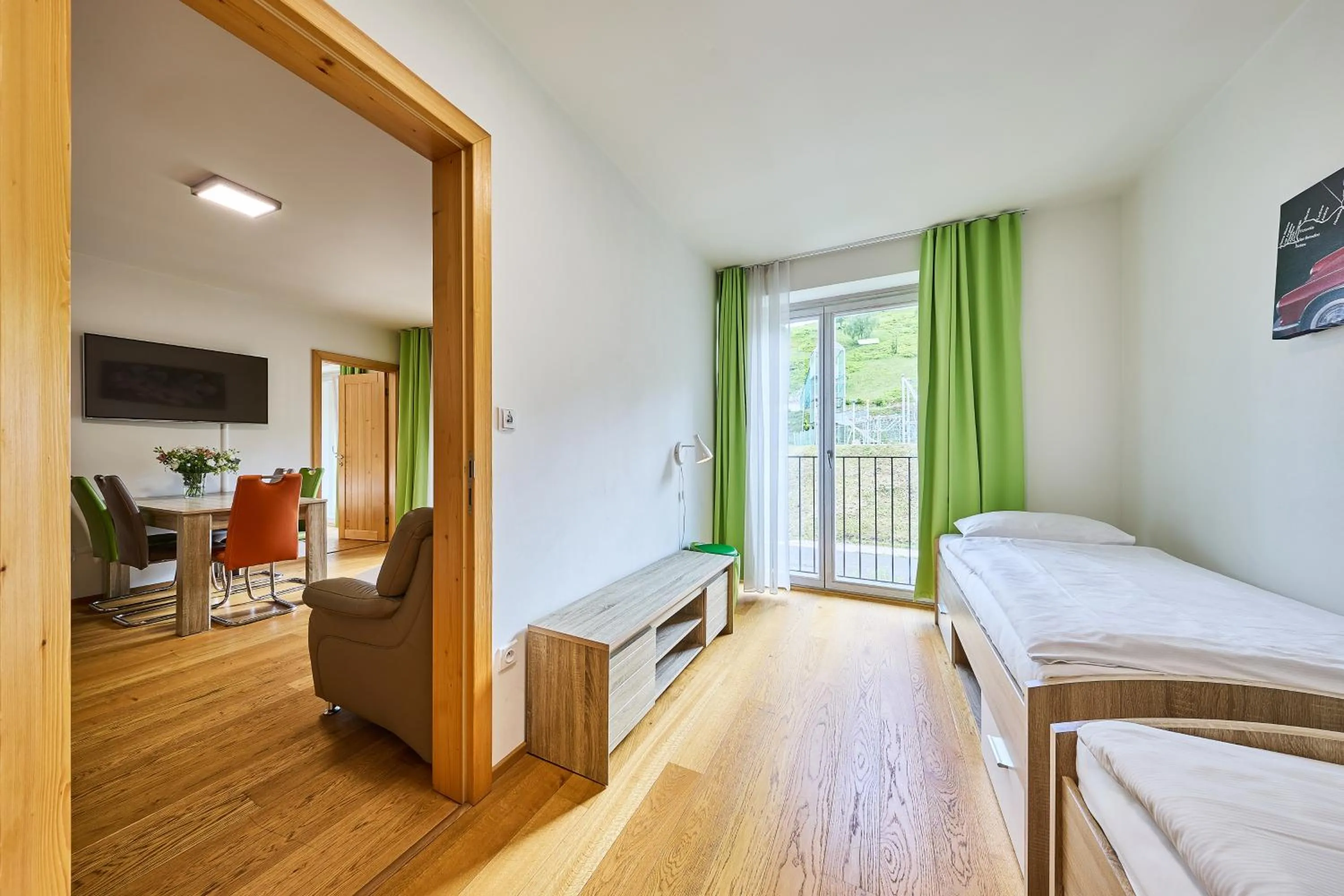 Communal lounge/ TV room, Bed in Aparthotel Kovarna Residence