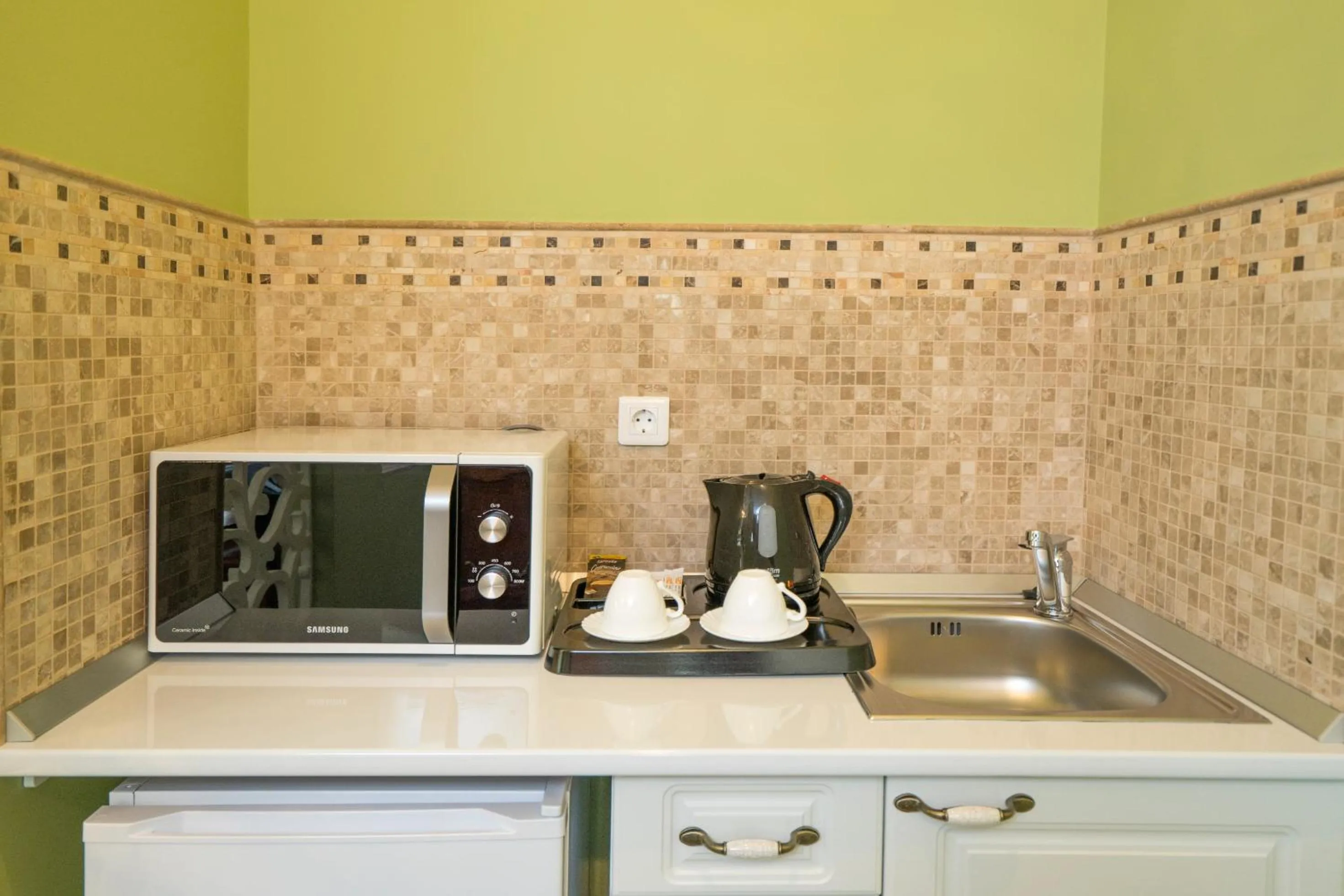 Kitchen or kitchenette in Studio One Accommodation Suites
