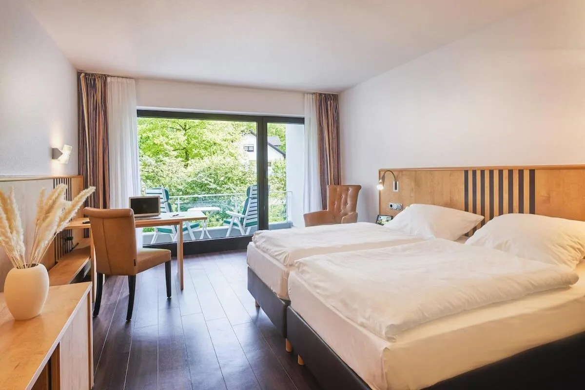 Photo of the whole room, Bed in Parkhotel Nümbrecht