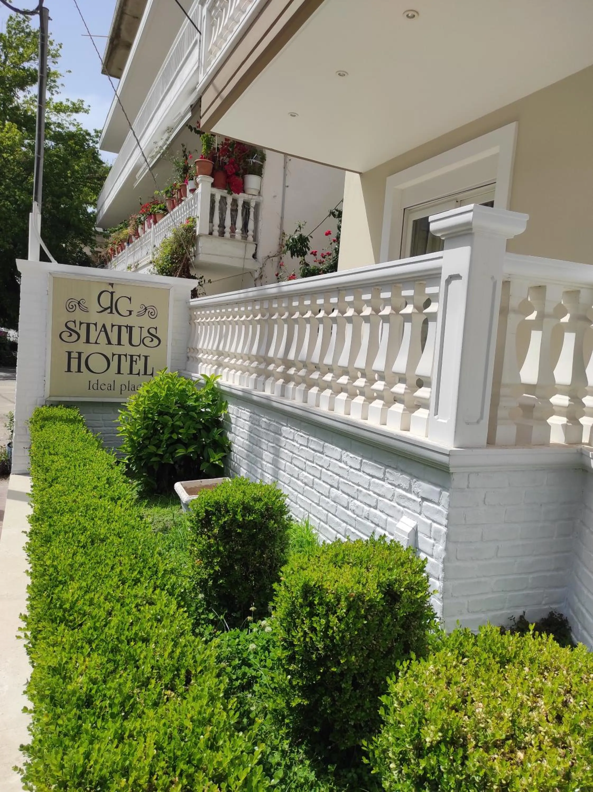 Property logo or sign in Rg Status Hotel