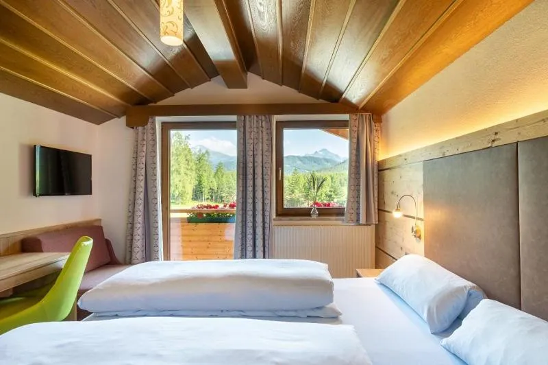 Photo of the whole room, Bed in Kinderhotel Lärchenhof