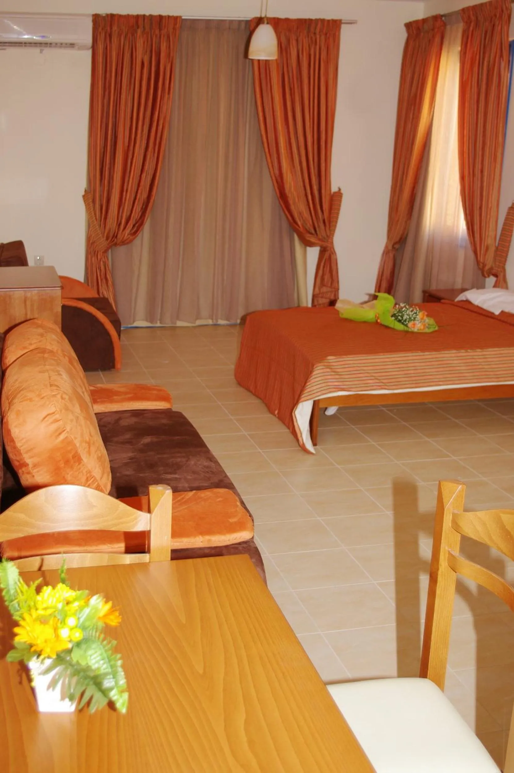 Seating area, Bed in Gold Apartments