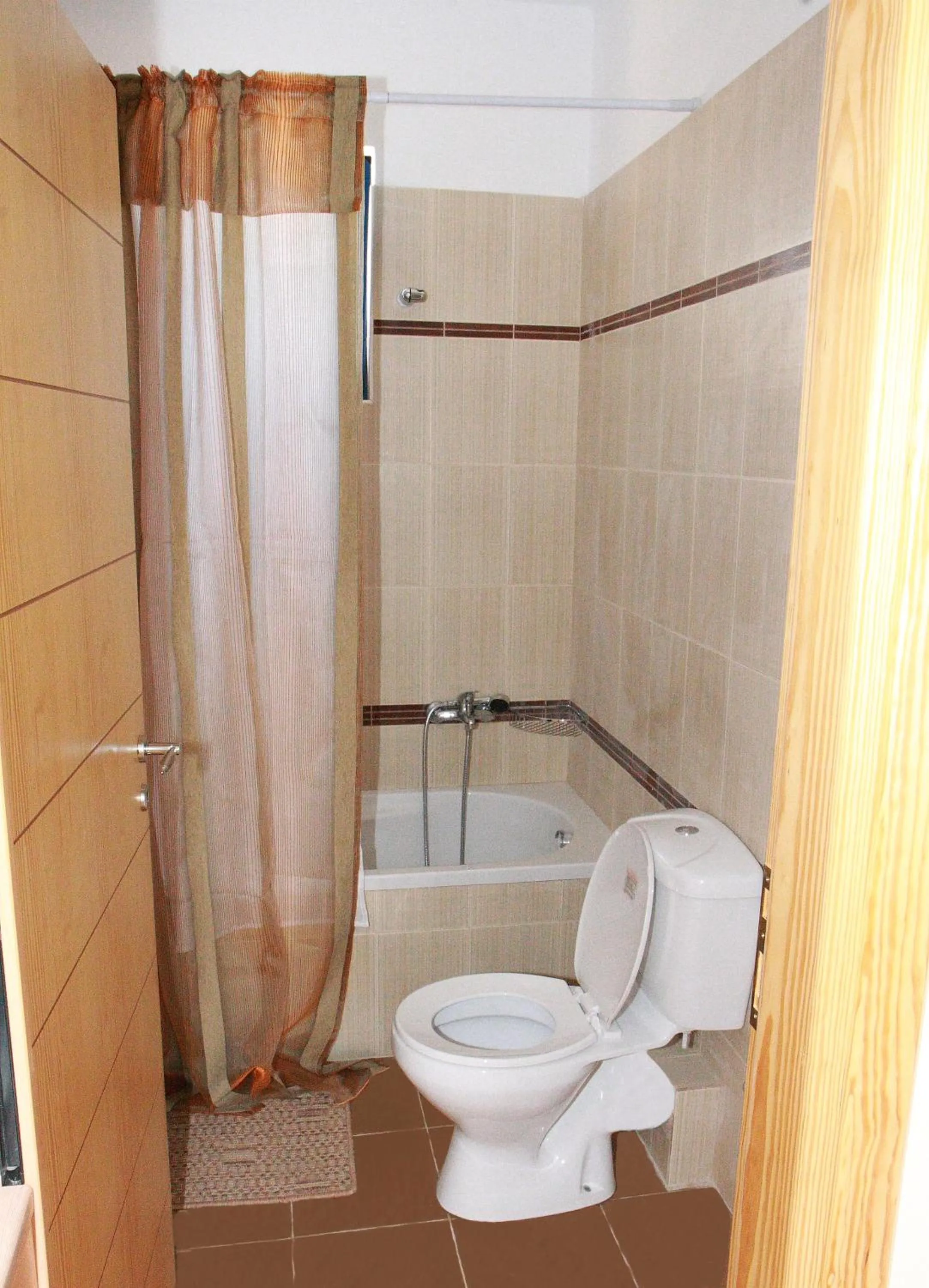 Toilet in Gold Apartments