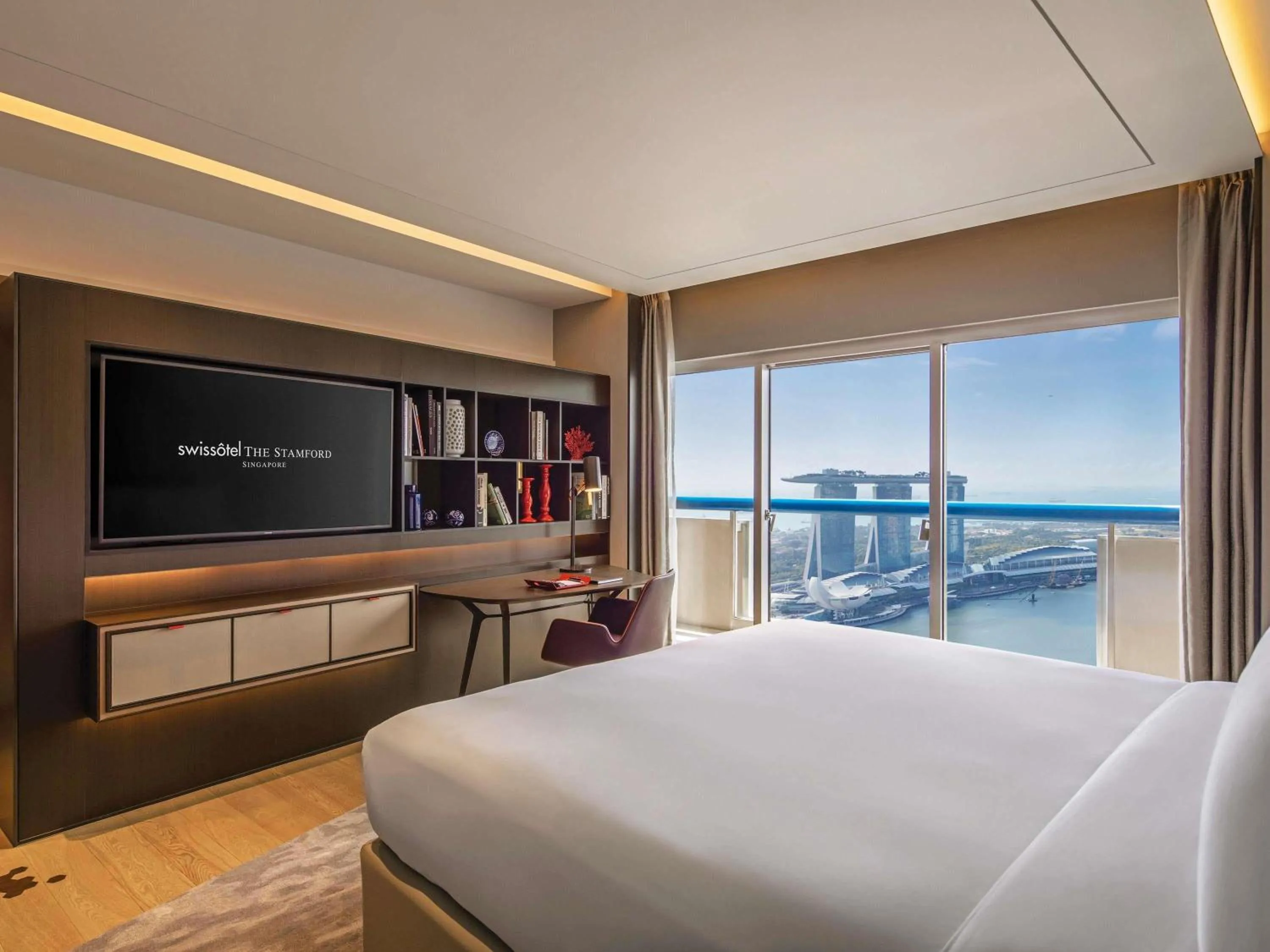 Property building, Bed in Swissotel The Stamford Singapore