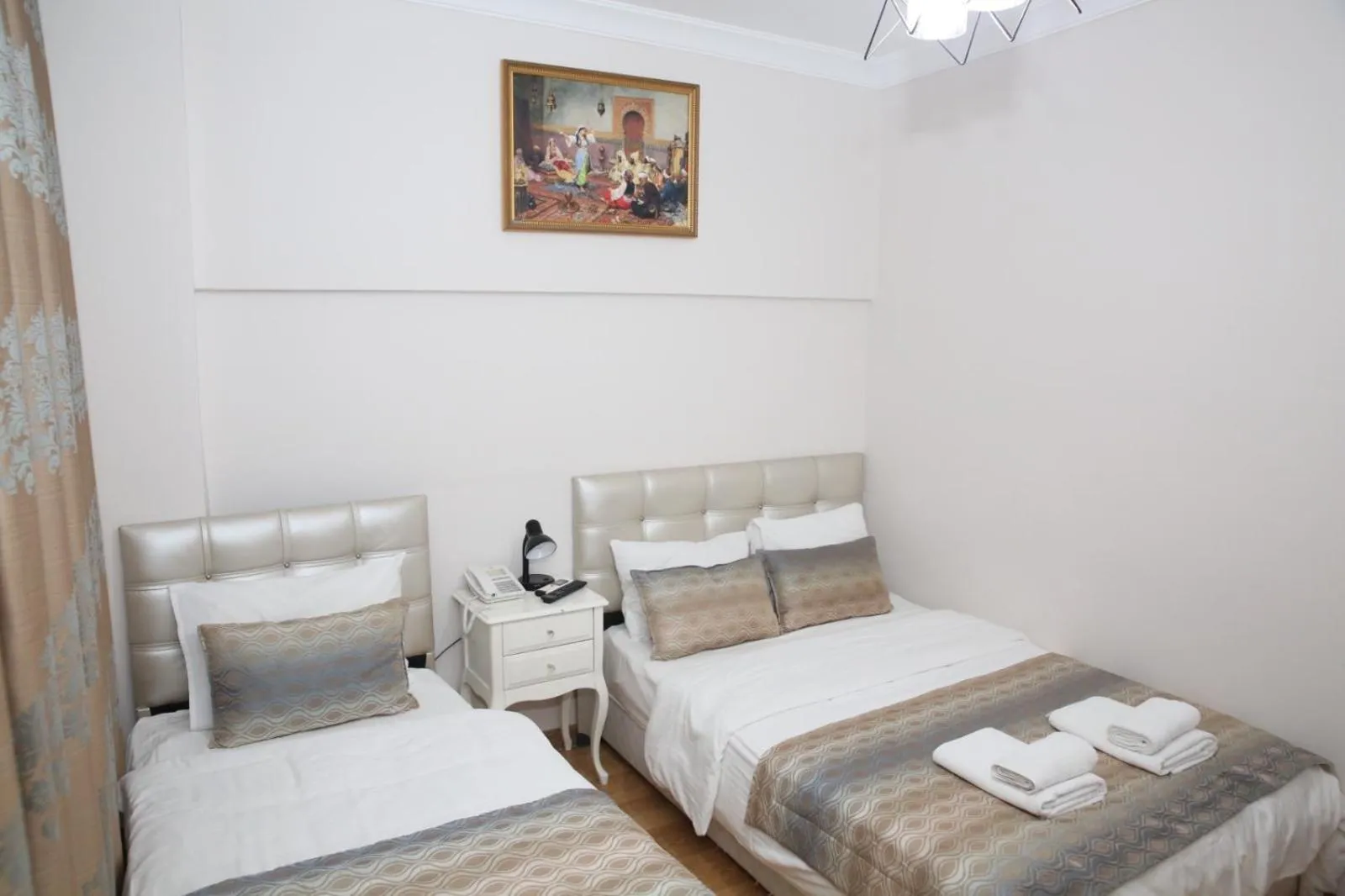 Bed in Rosalie Palace Hotel