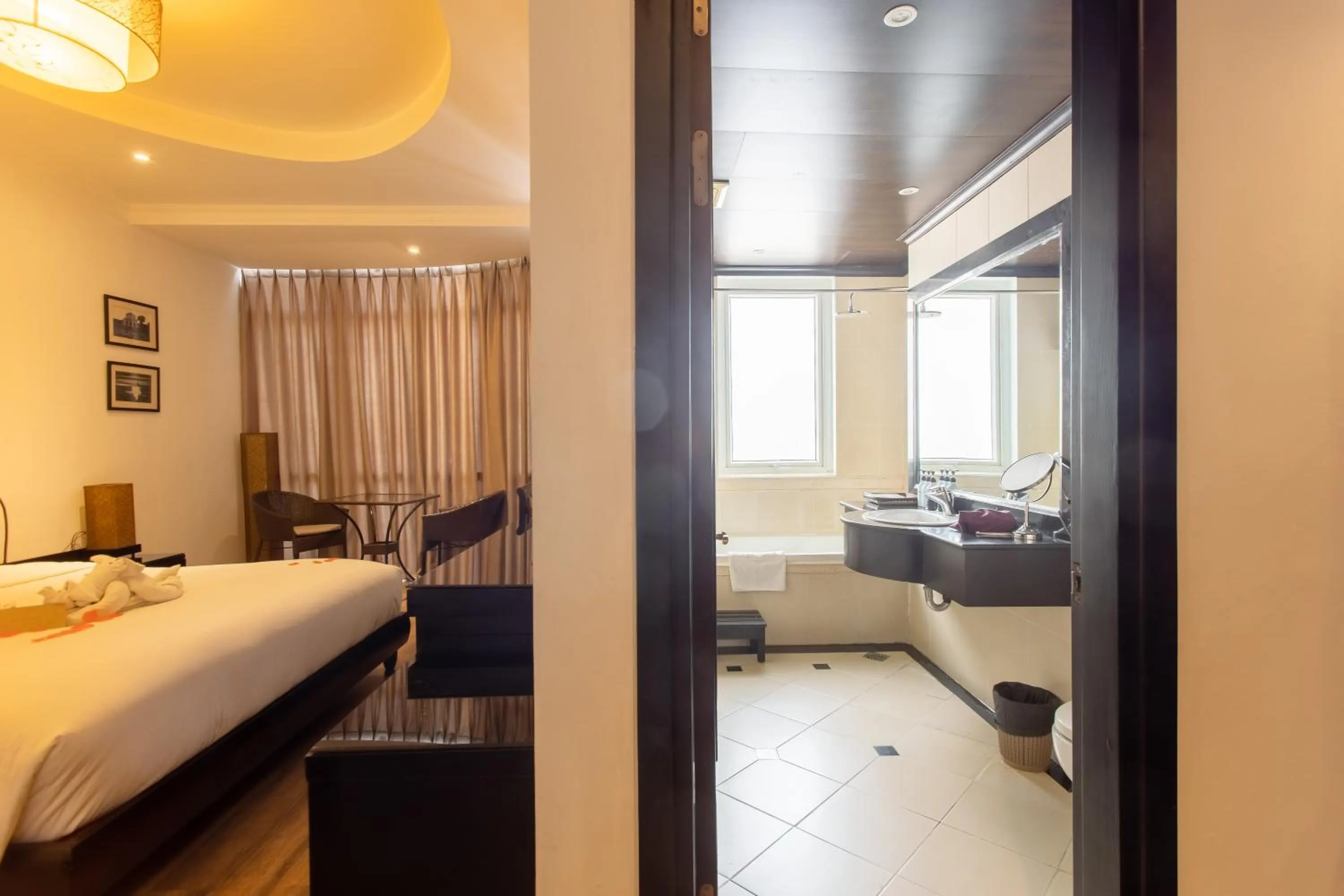 Shower, Bed in Orchid Hotel