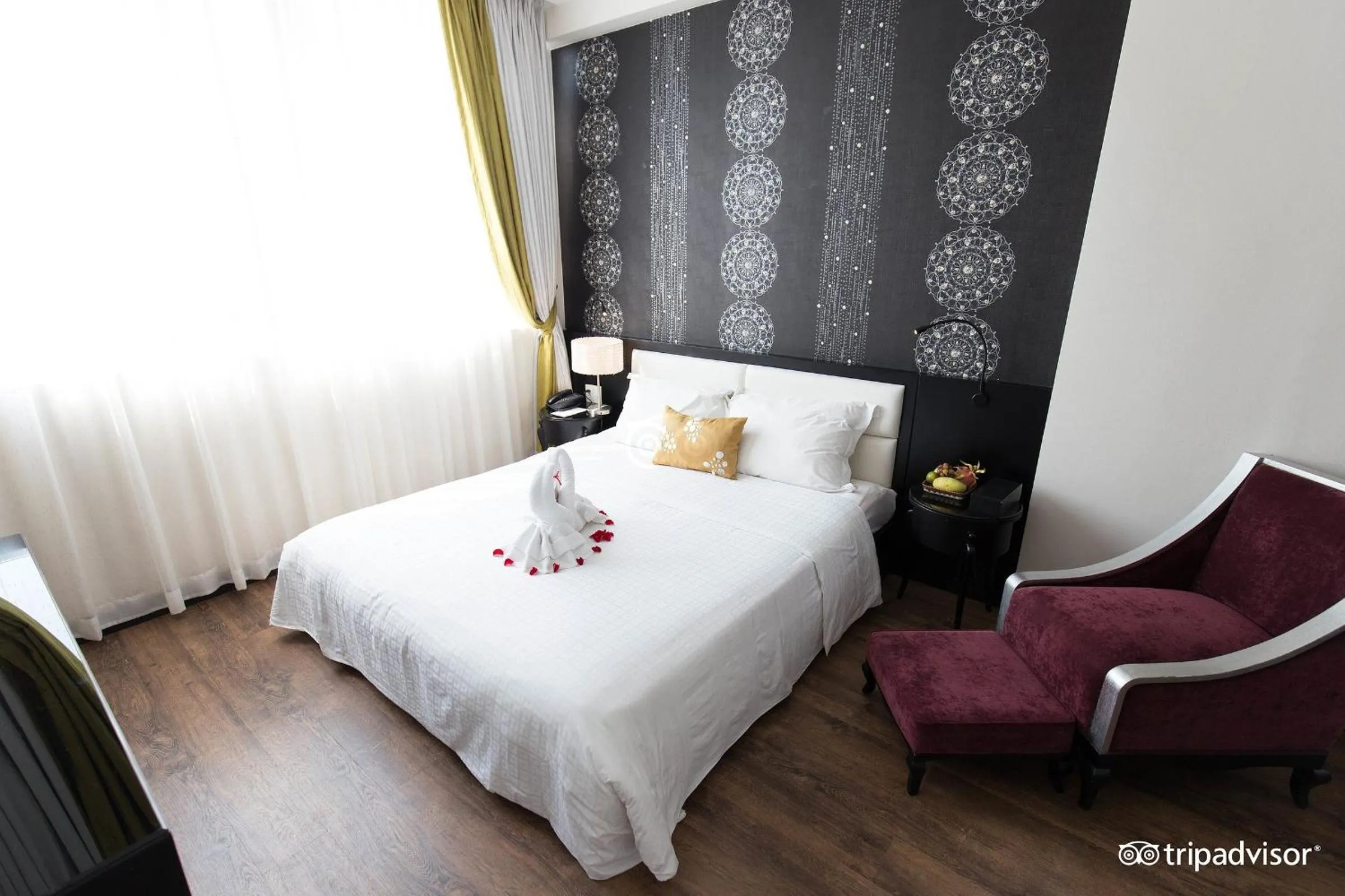 Seating area, Bed in Orchid Hotel