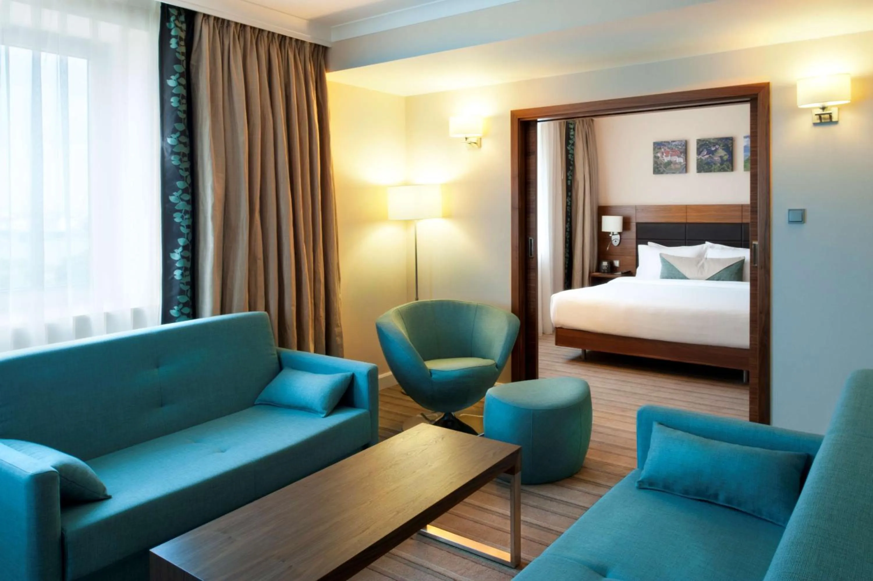Living room, Bed in Hilton Garden Inn Krakow