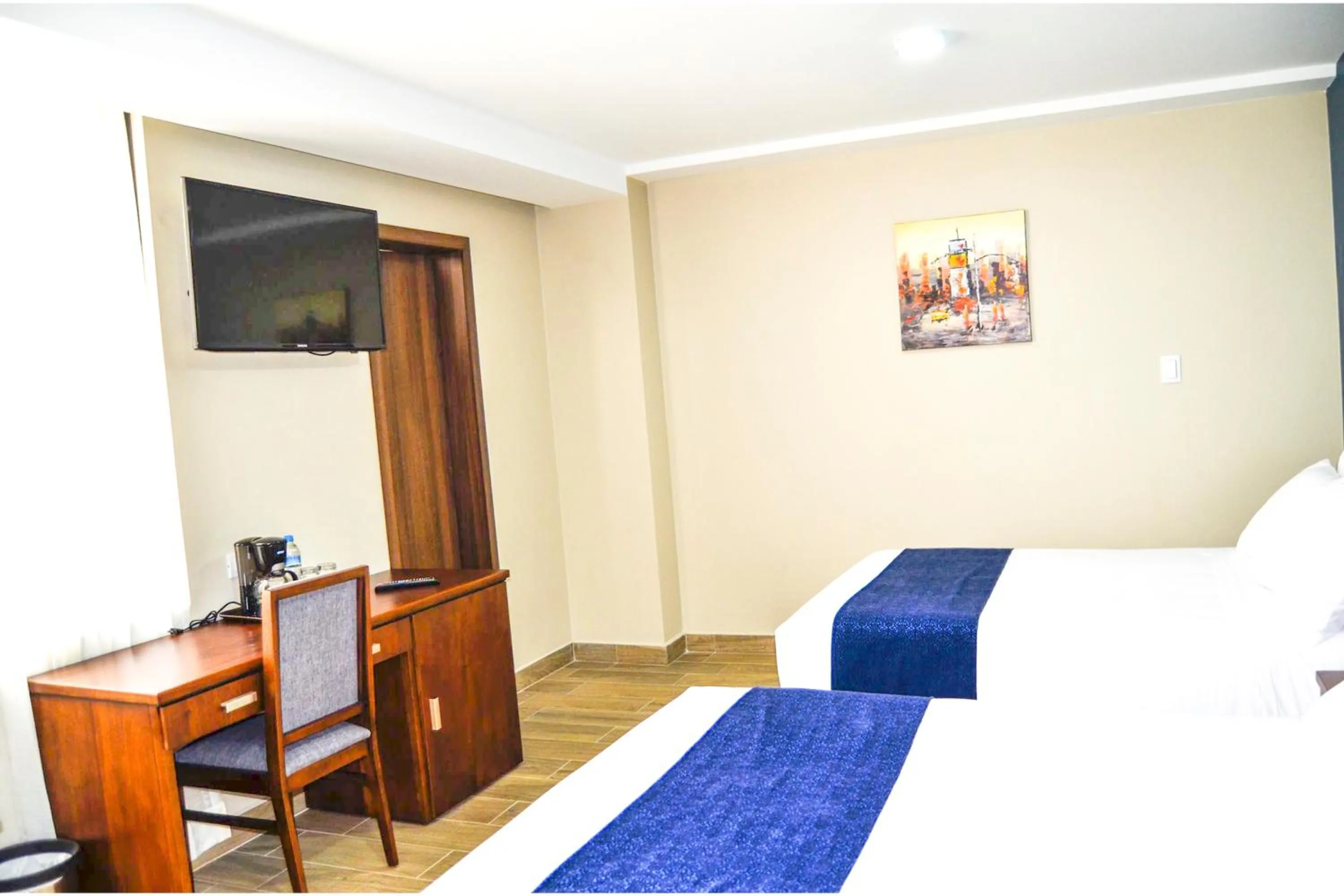 Bed in Hotel San Agustin Plaza