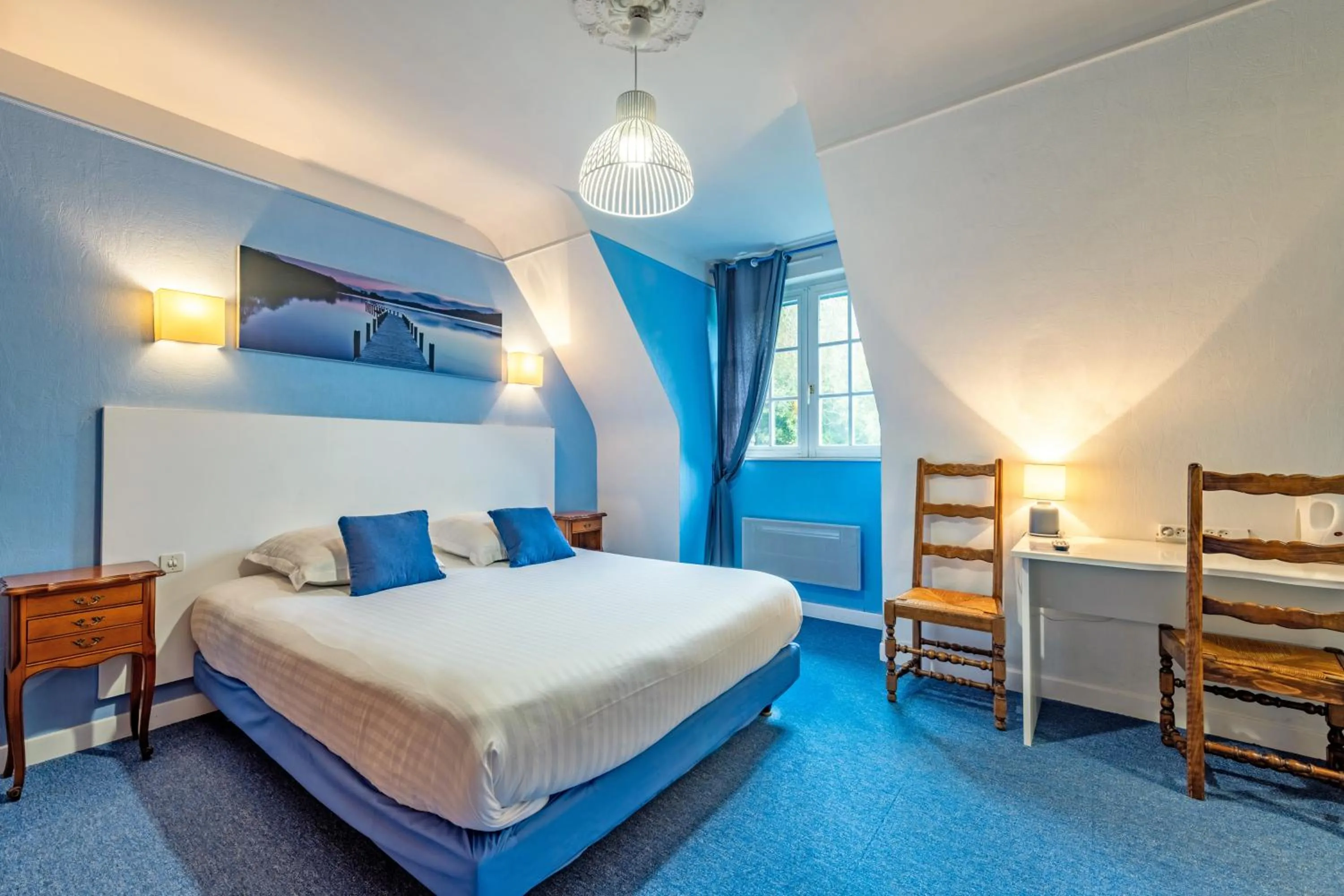 Bed in Logis Hotel De La Corniche