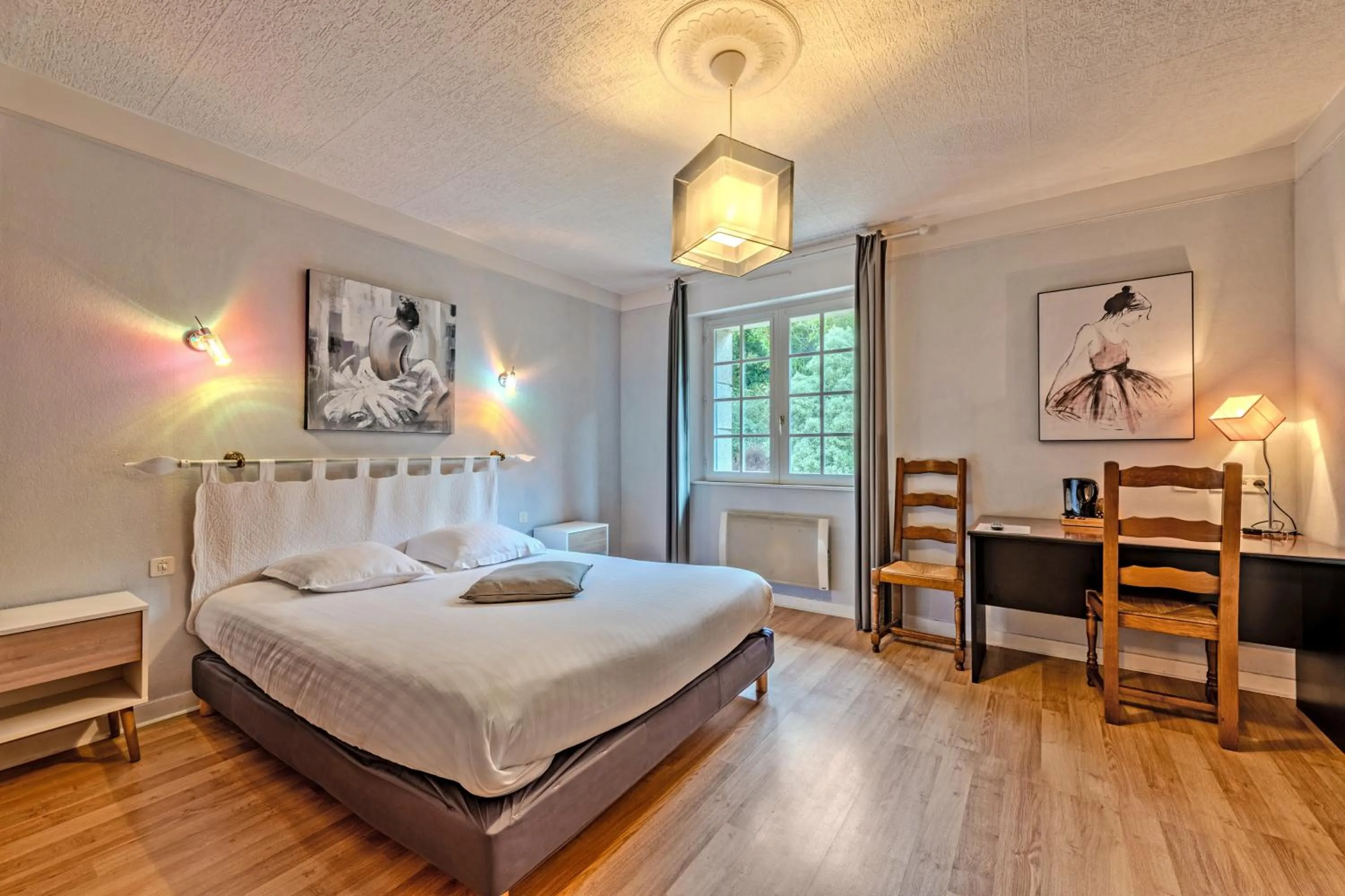 Bed in Logis Hotel De La Corniche