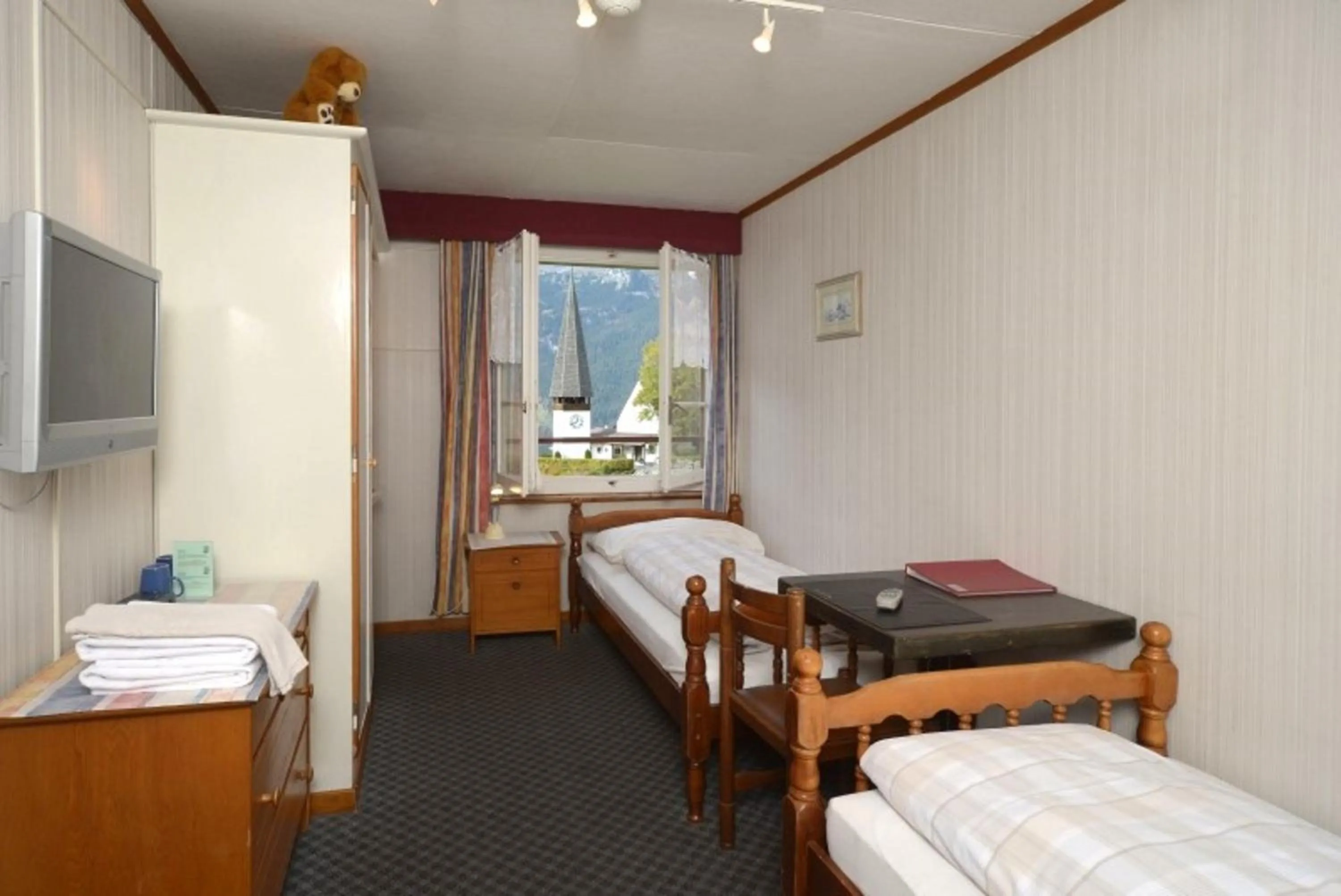 Bed in Swiss Lodge Hotel Bernerhof